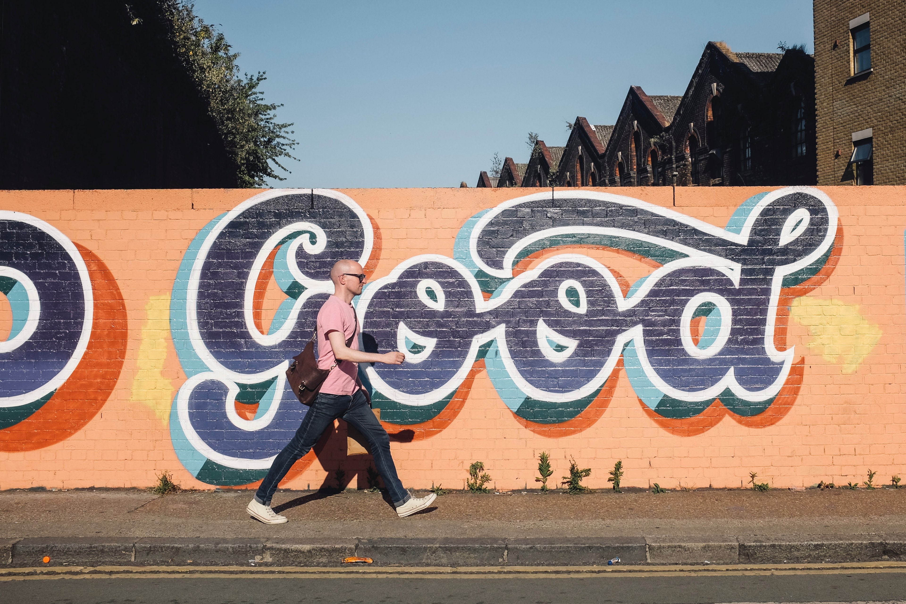 bald man walks in front of graffiti 4k, HD Wallpaper