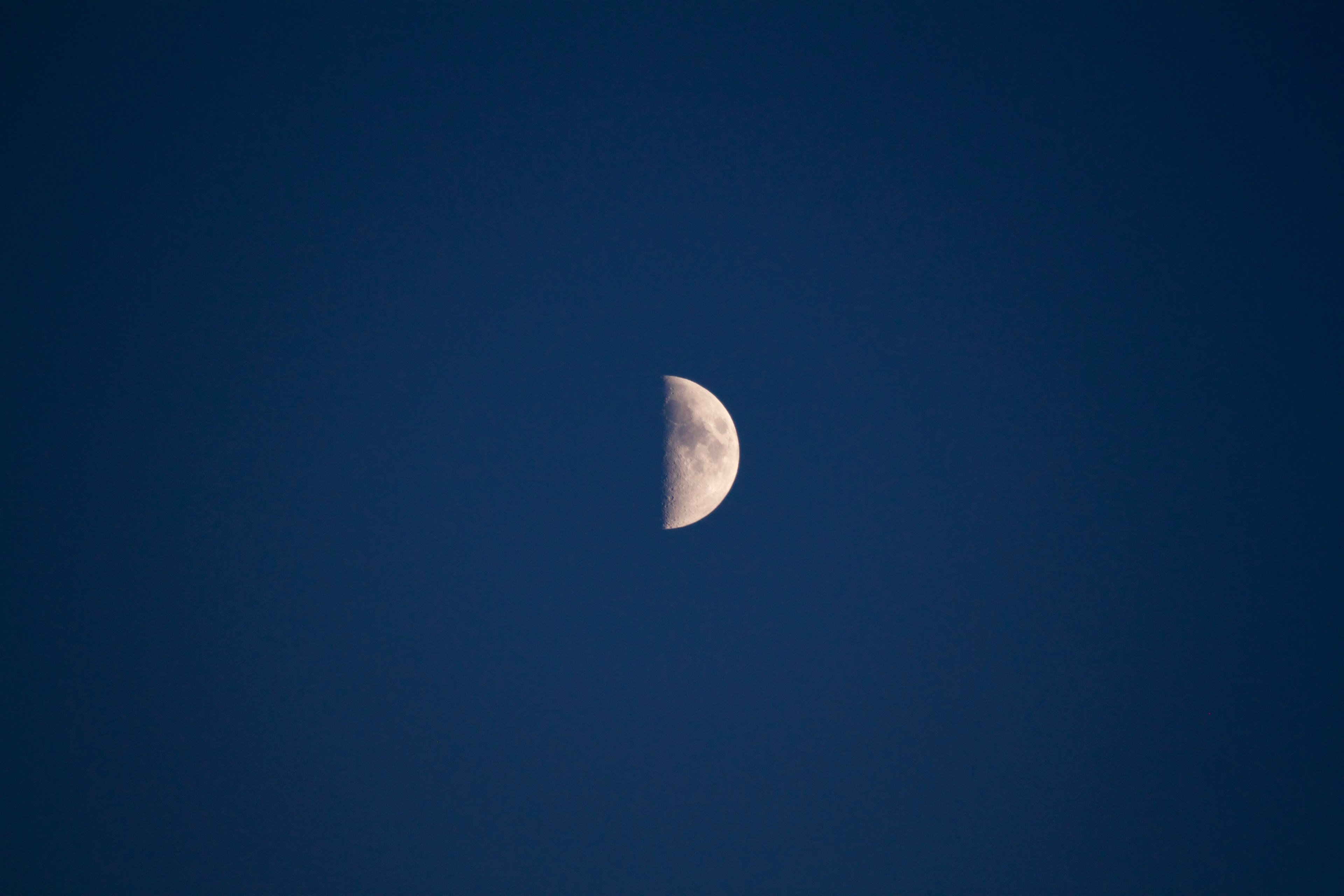 half moon with visible dark spots in the inky blue sky, half moon 4k, HD Wallpaper