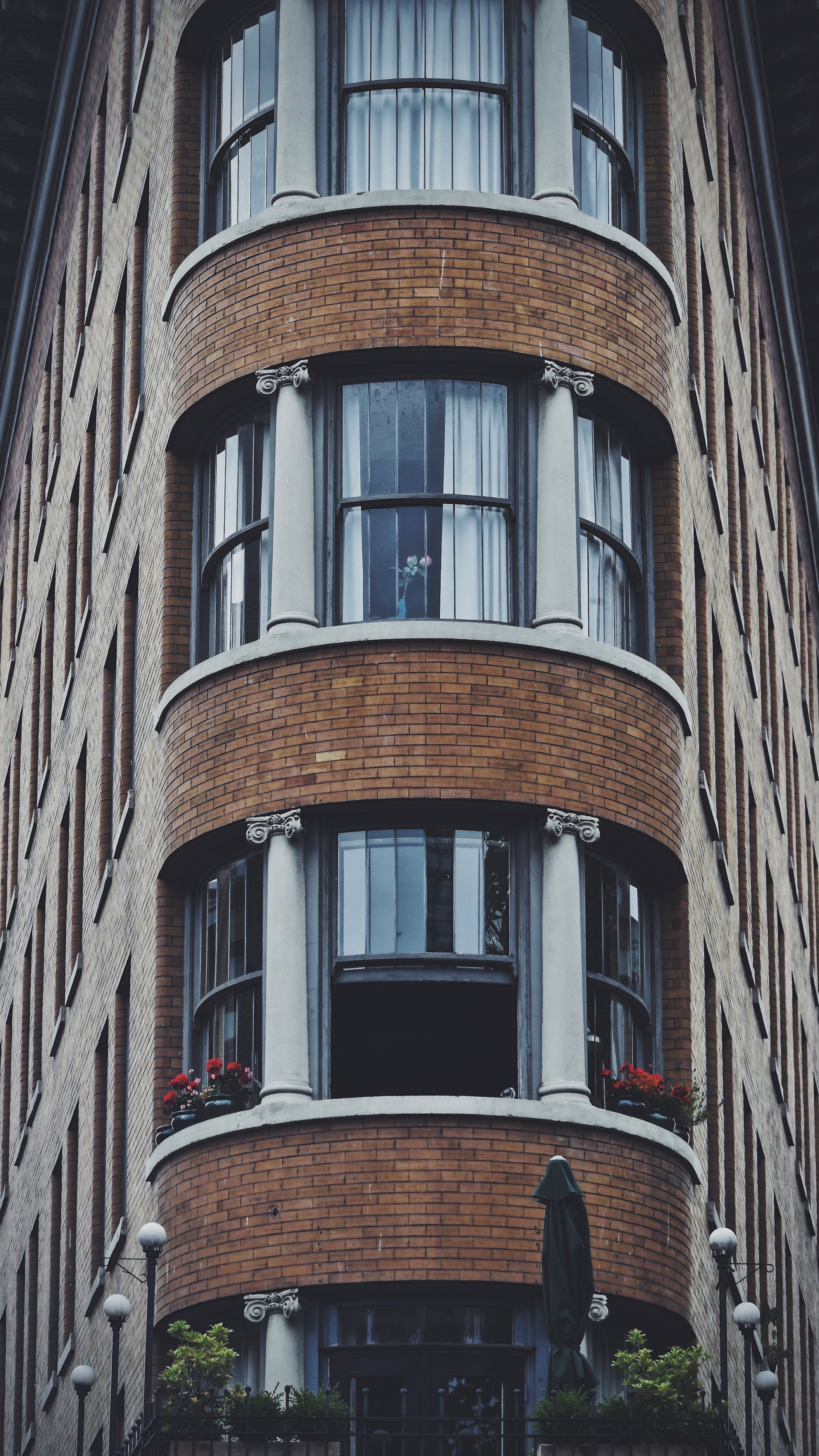 the classical facade of the hotel europe has circular balconies with ionic columns on brick walls, symmetrical hotel_ 4k, Phone HD Wallpaper