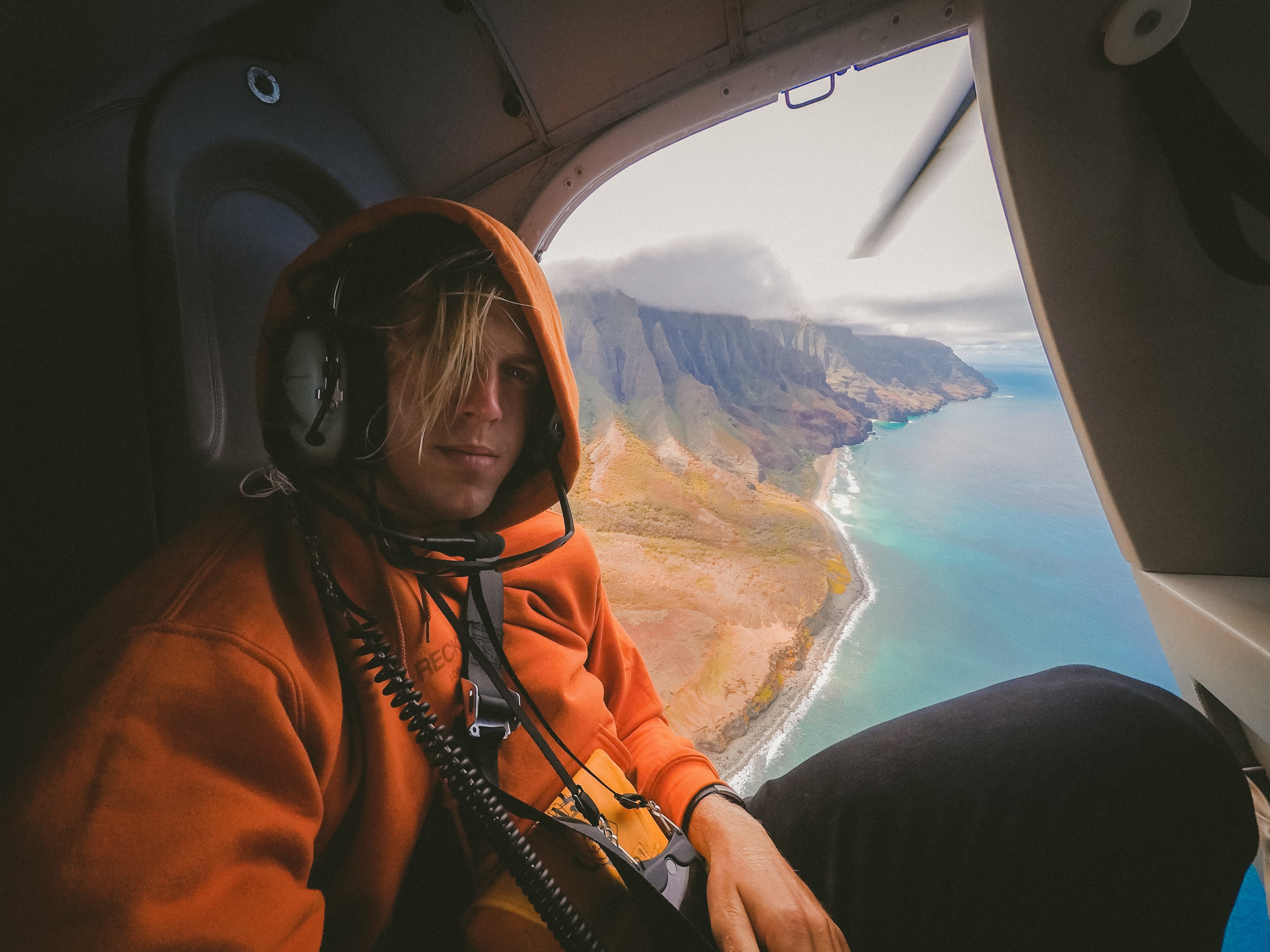 a male passenger in a helicopter flying over the shore of kauai, _hi 4k, HD Wallpaper