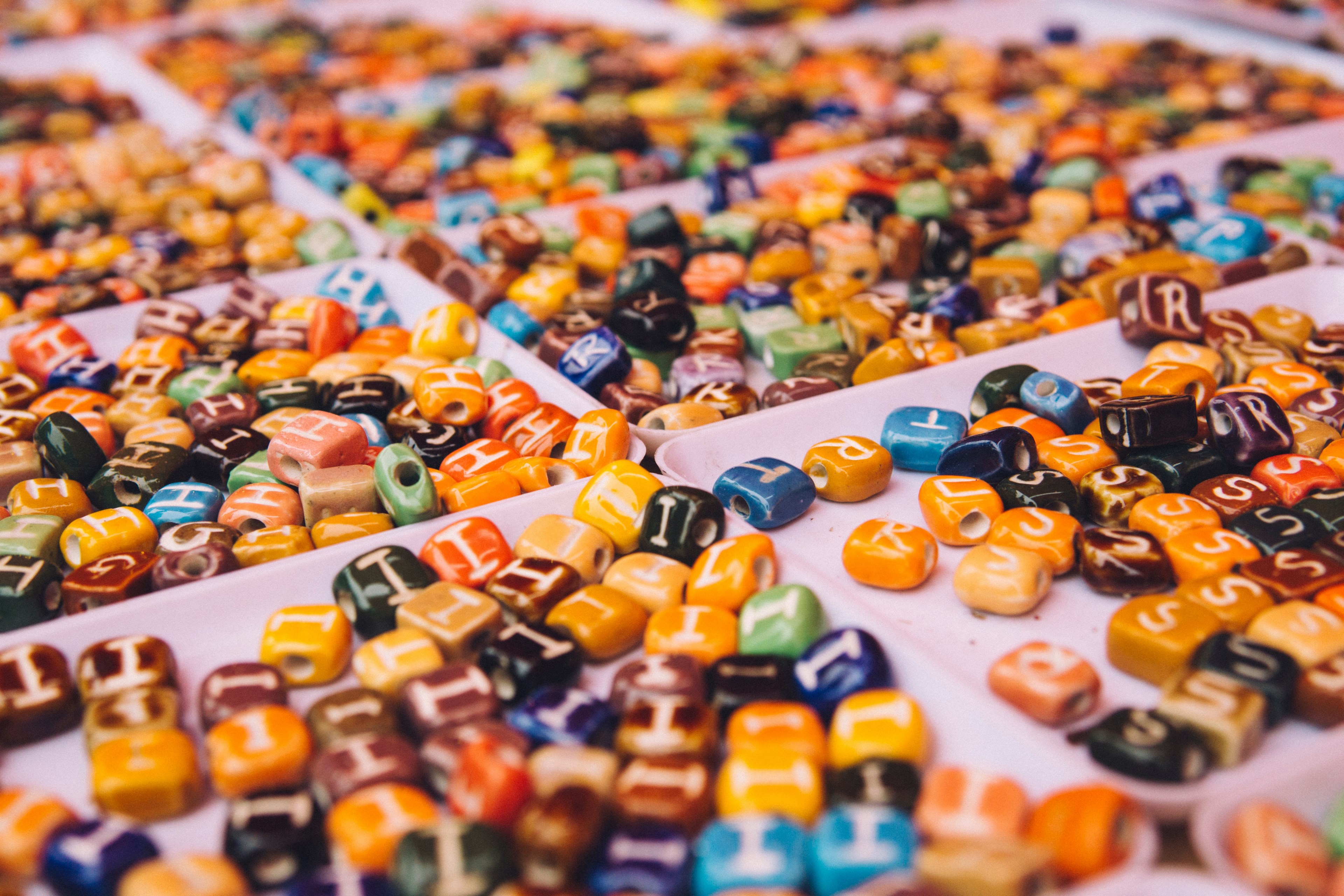 trays of colorful beads with letters at a craft market, letters 4k, HD Wallpaper