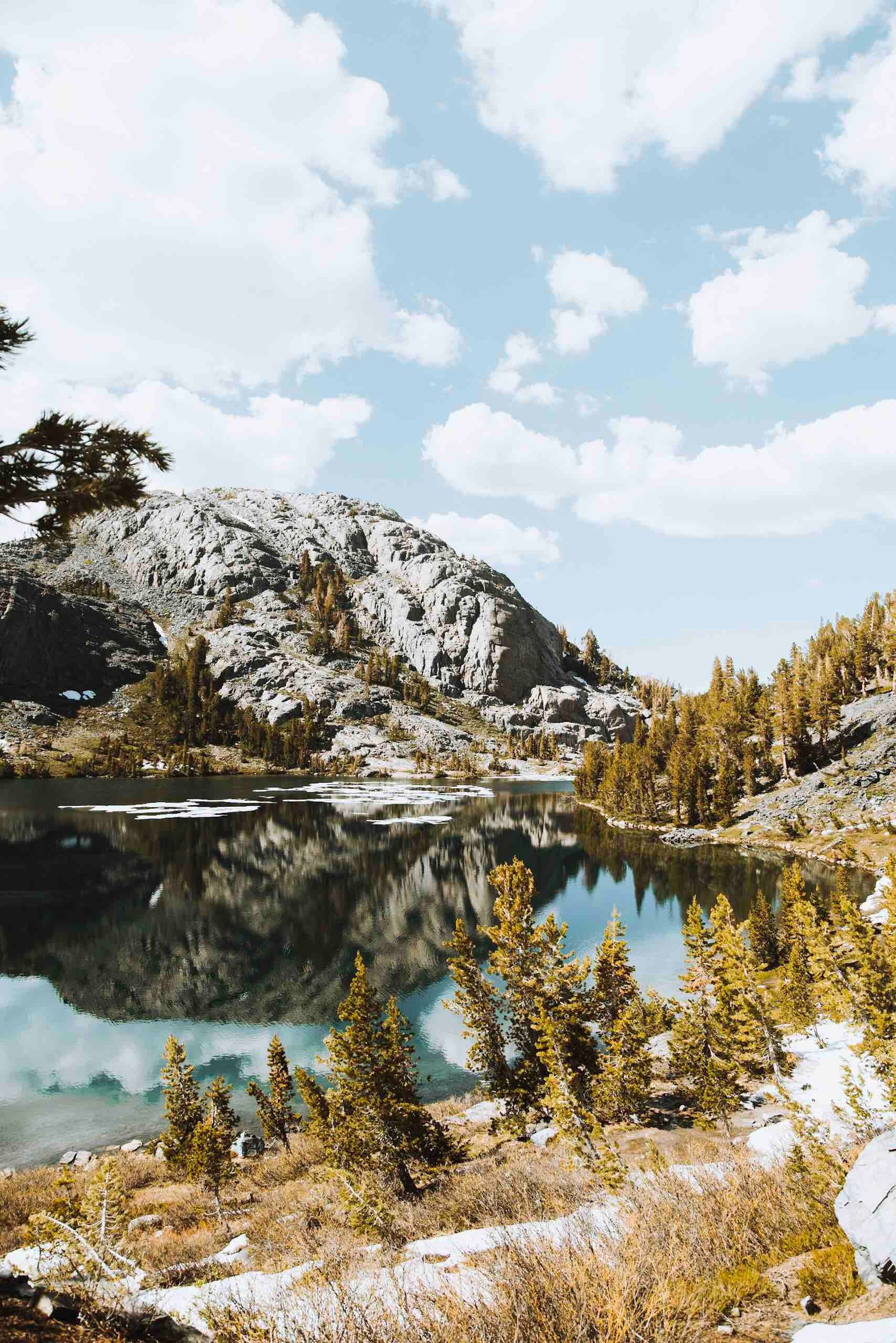 serene pond with green foliage and giant rocks surrounding, lets go for a dip 4k, Phone HD Wallpaper