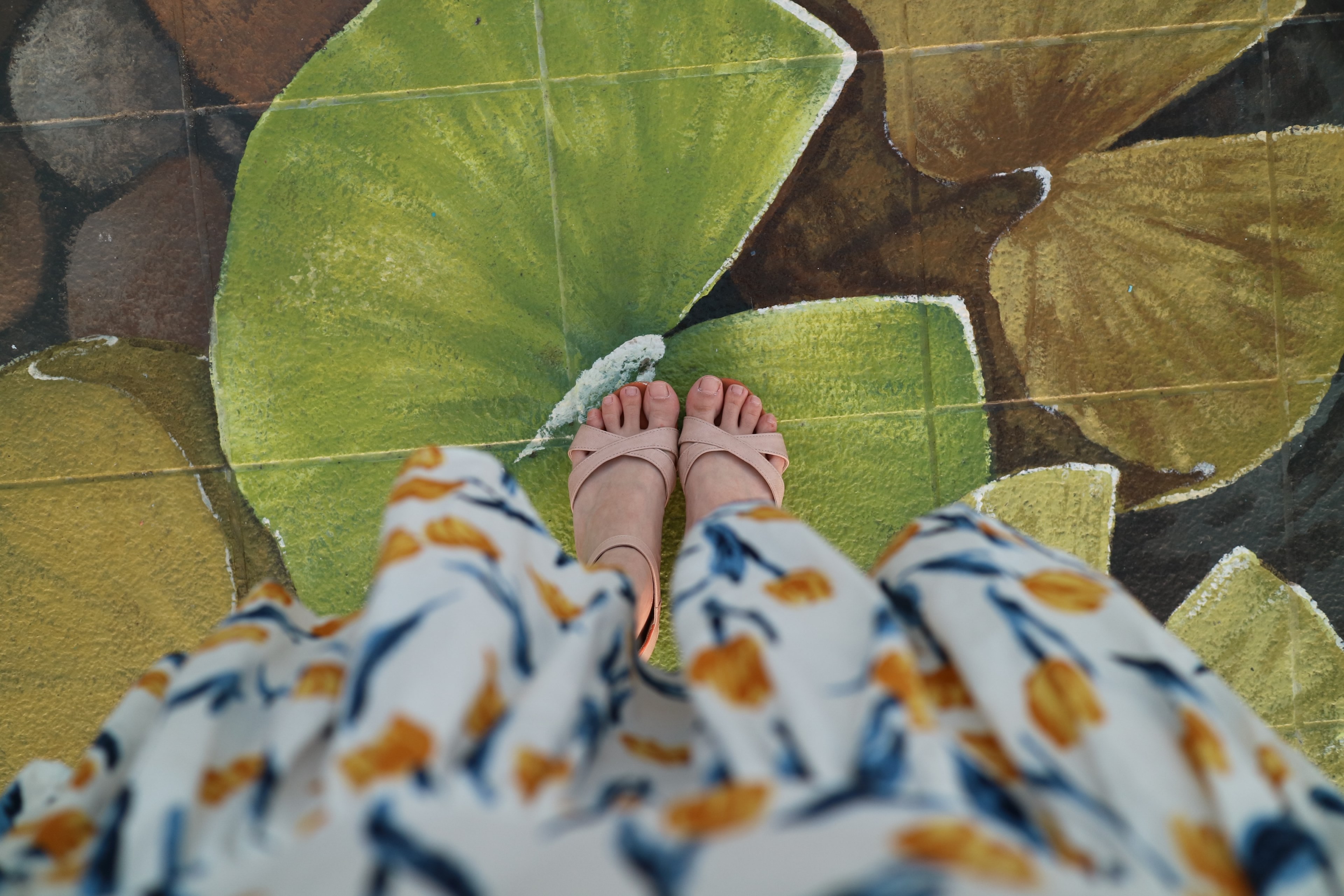 woman in floral dress and sandals feet standing on green water lily street art busan, woman stands on painted street 4k, HD Wallpaper