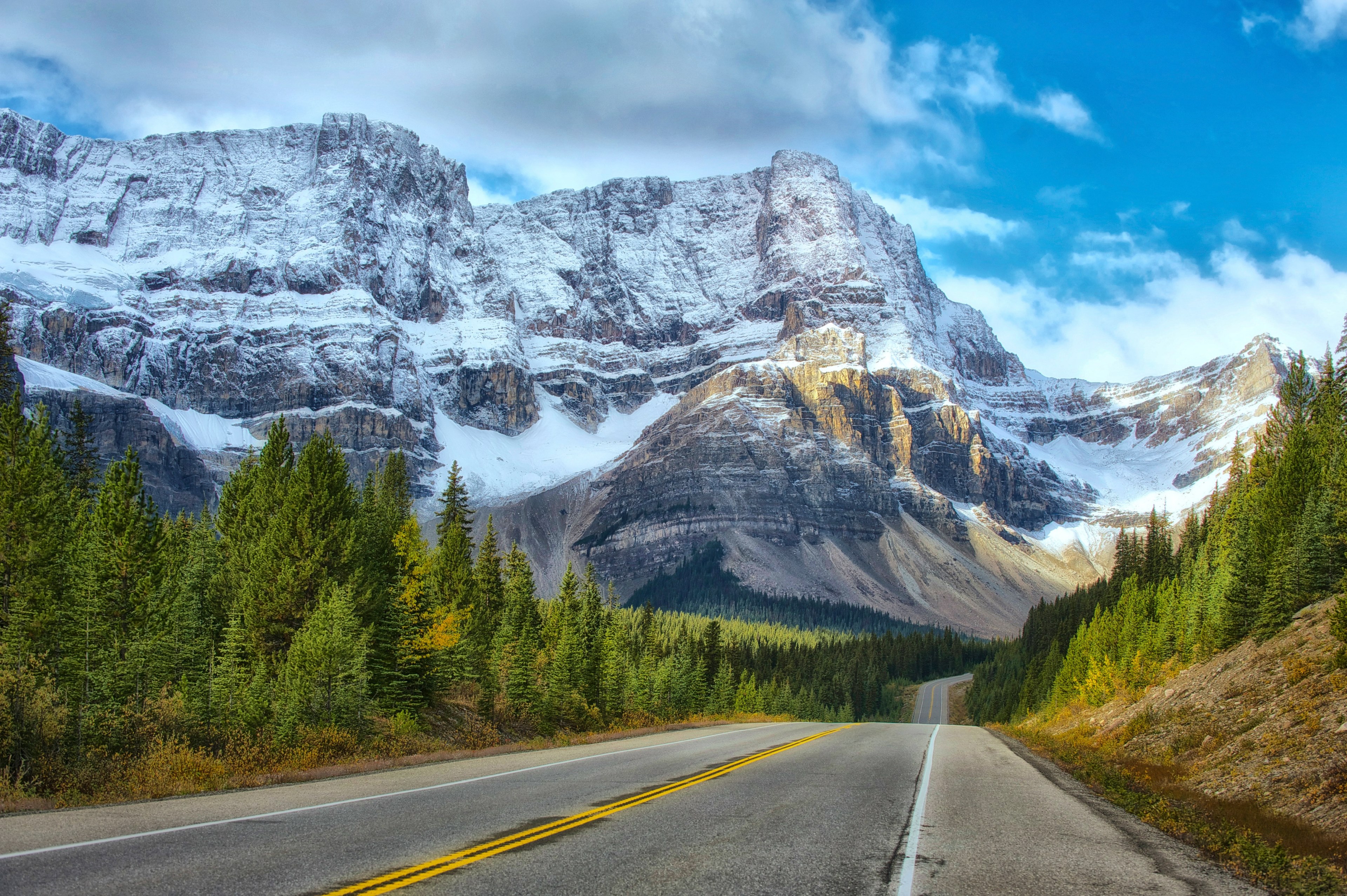 an empty asphalt road twisting up and down along snowy mountains, banff 4k, HD Wallpaper