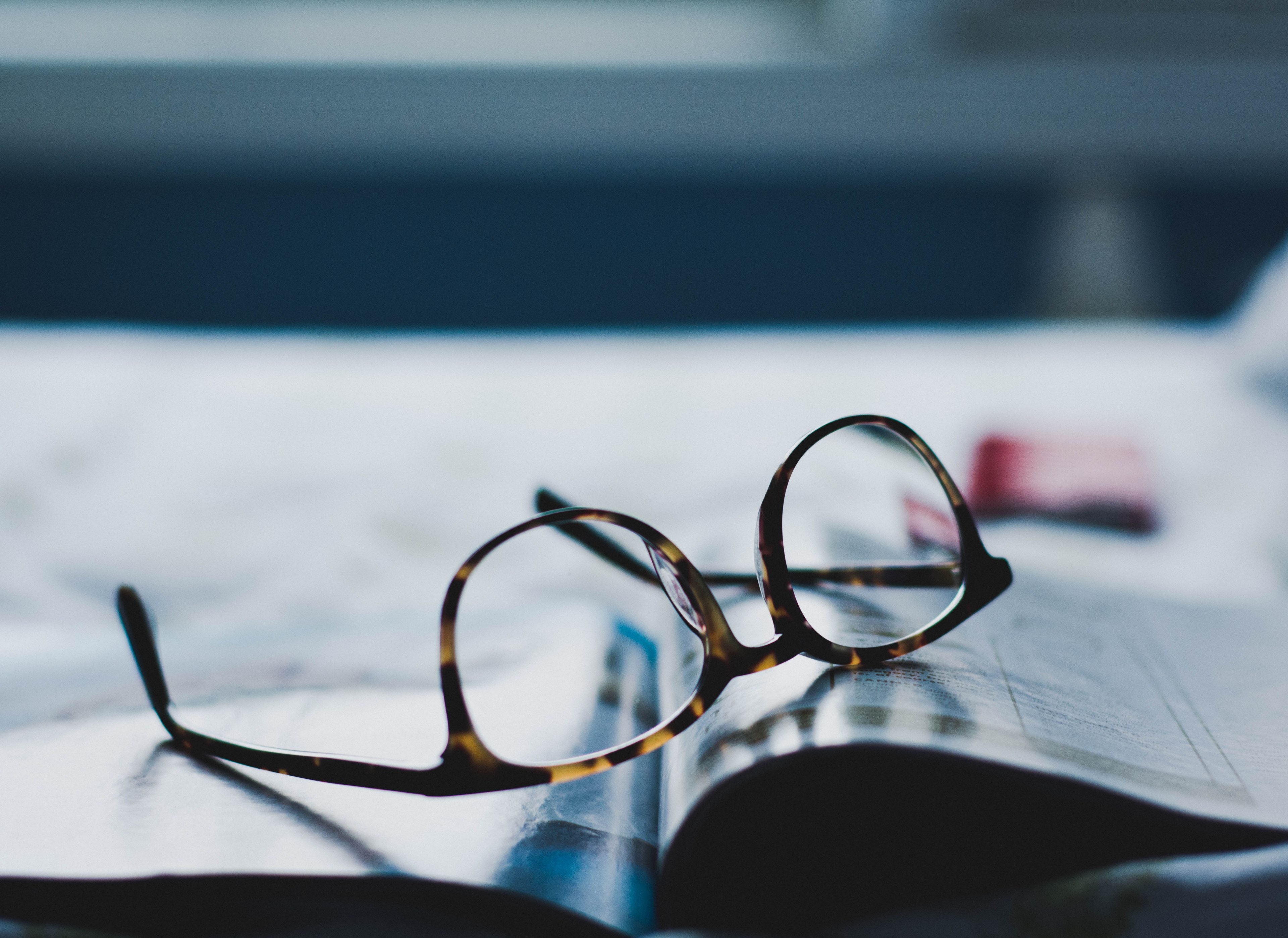 a pair of glasses on an open magazine, glasses and a magazine 4k, HD Wallpaper