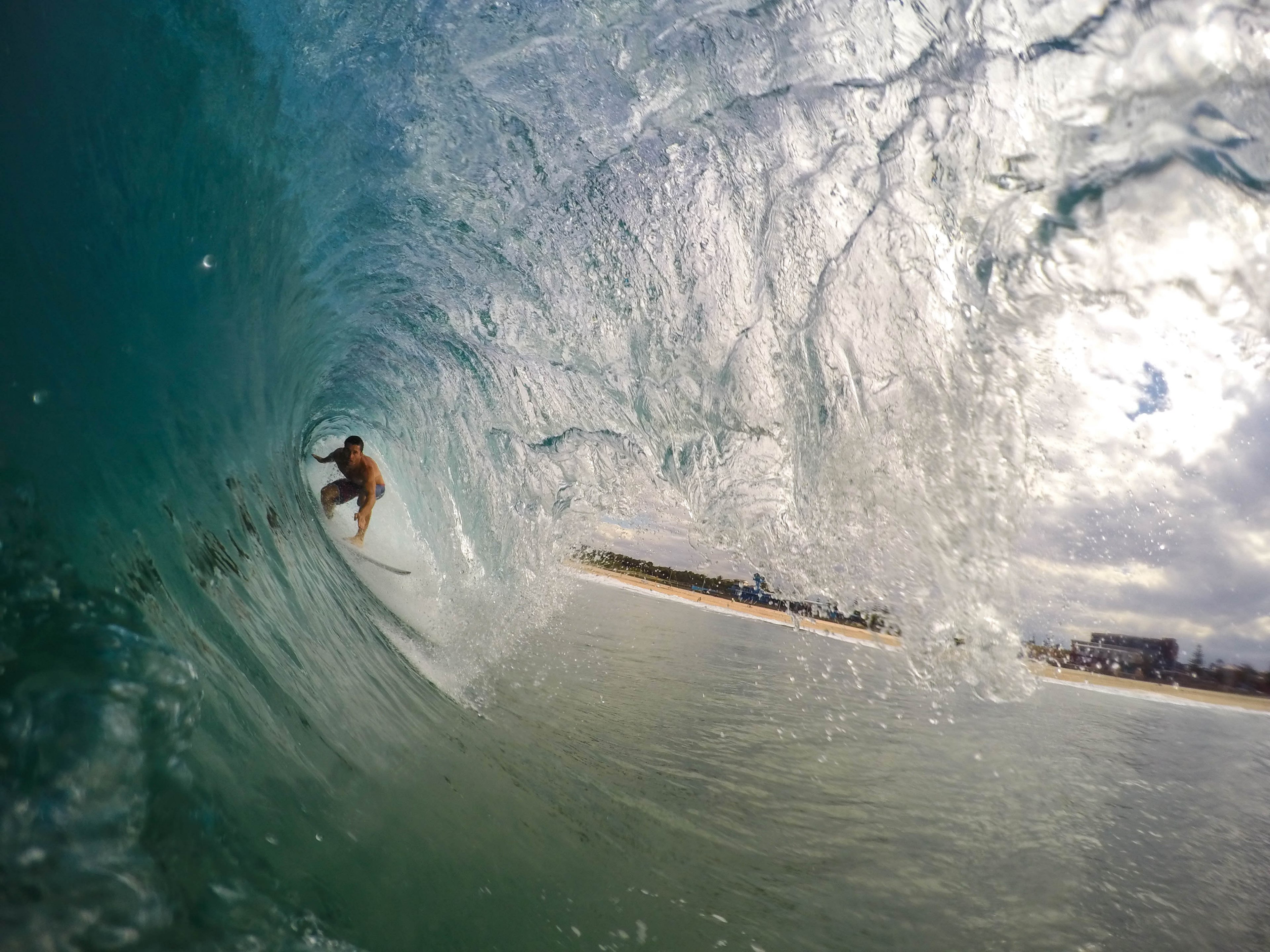 a surfer riding a large wave near a beach, surfer under a wave 4k, HD Wallpaper
