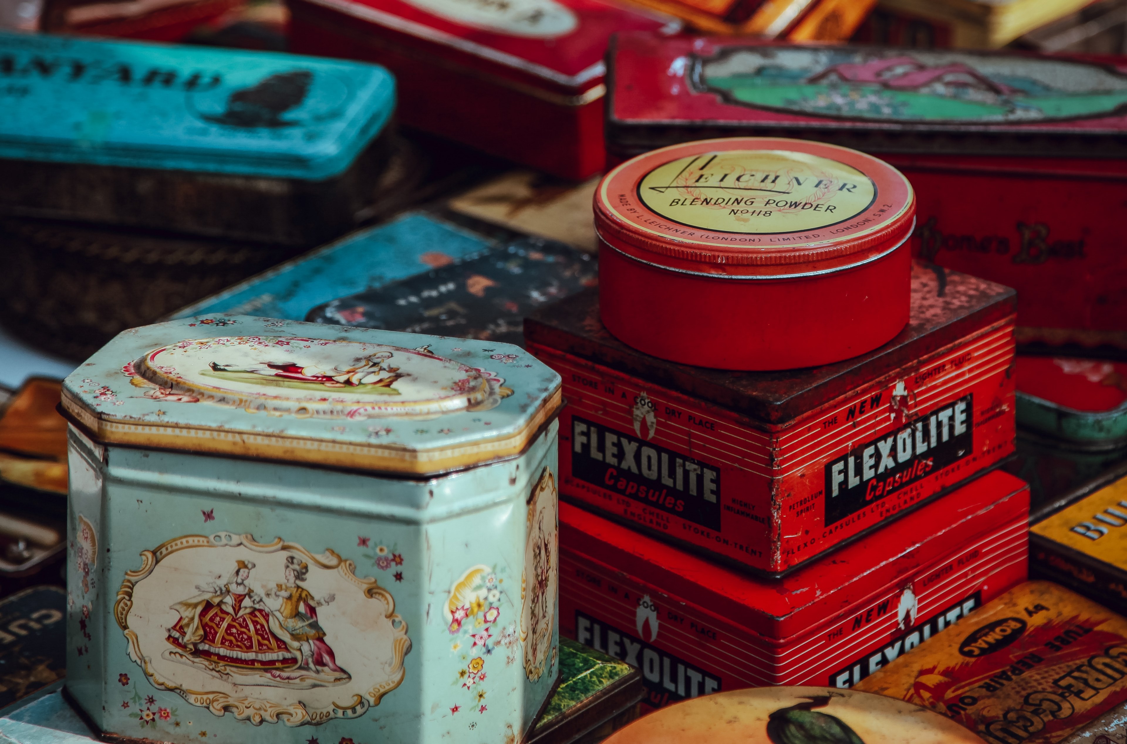 old stuff packaged in tin and boxes stacked together in a flea market at lewis cubits square, _packages once loved 4k, HD Wallpaper