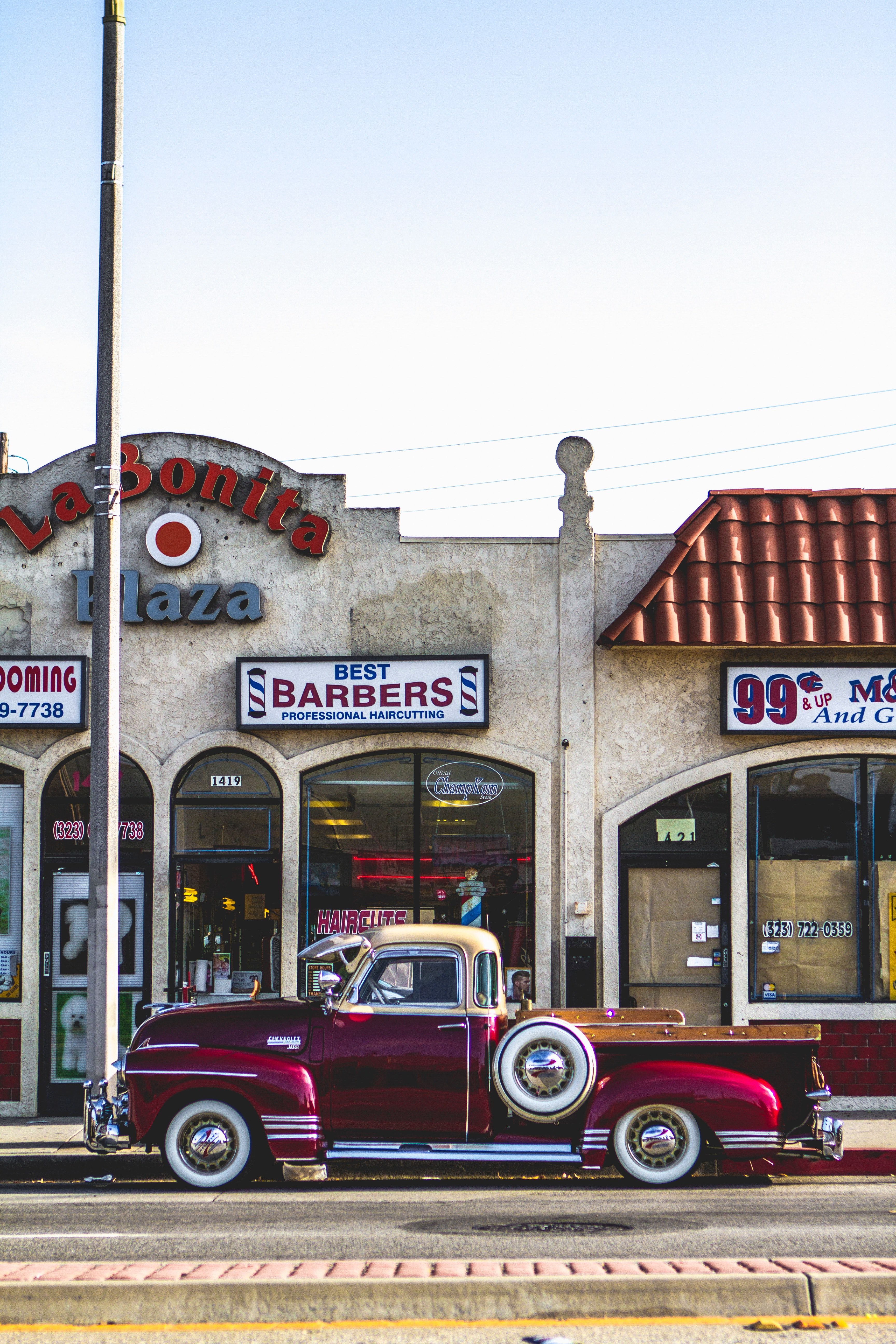 vintage red chevrolet pickup truck parked on pavement in front of barbershop in montebello, red chevrolet barbershop 4k, Phone HD Wallpaper