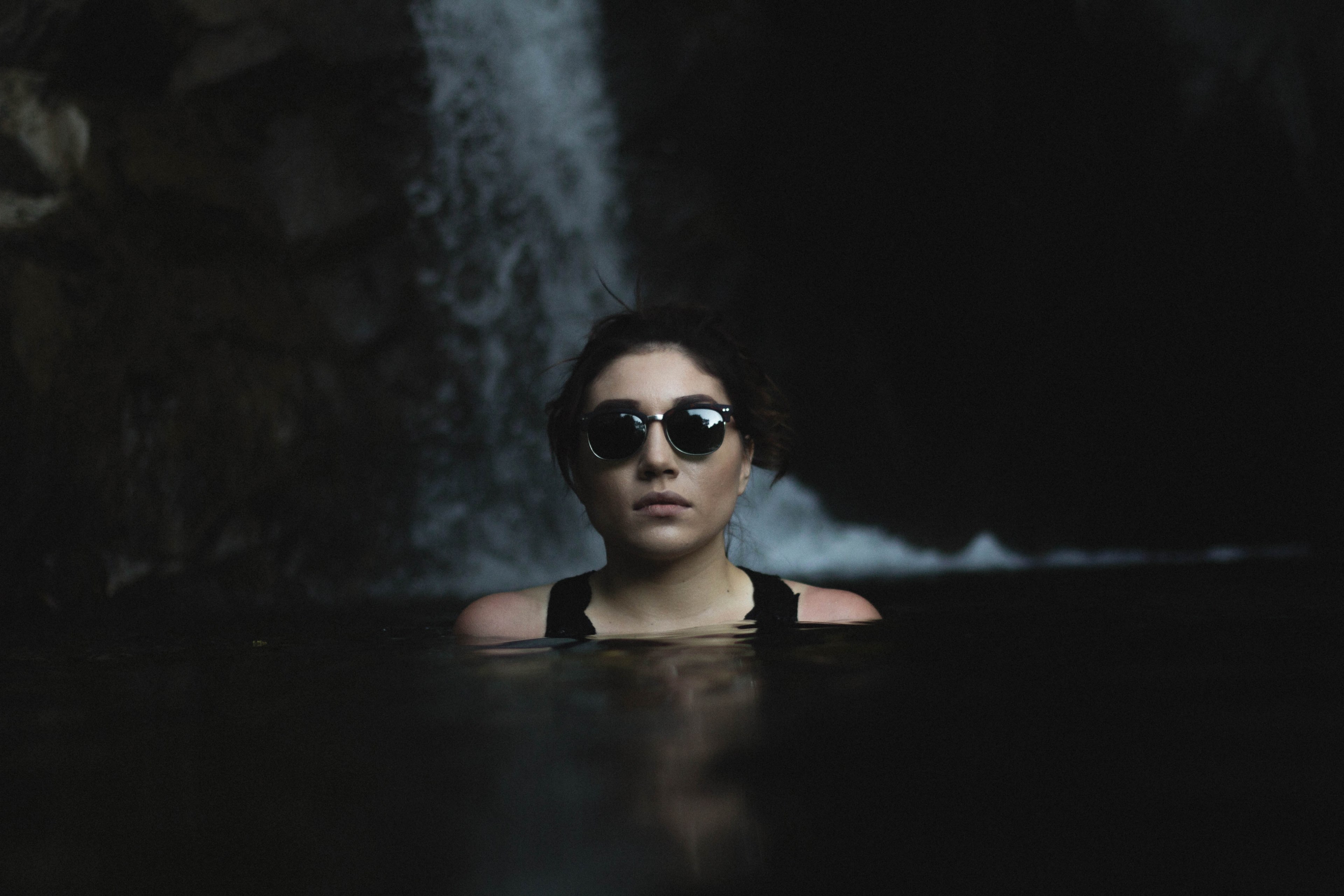 woman in sunglasses relaxing alone in a cold mountain lake, submerged in water 4k, HD Wallpaper
