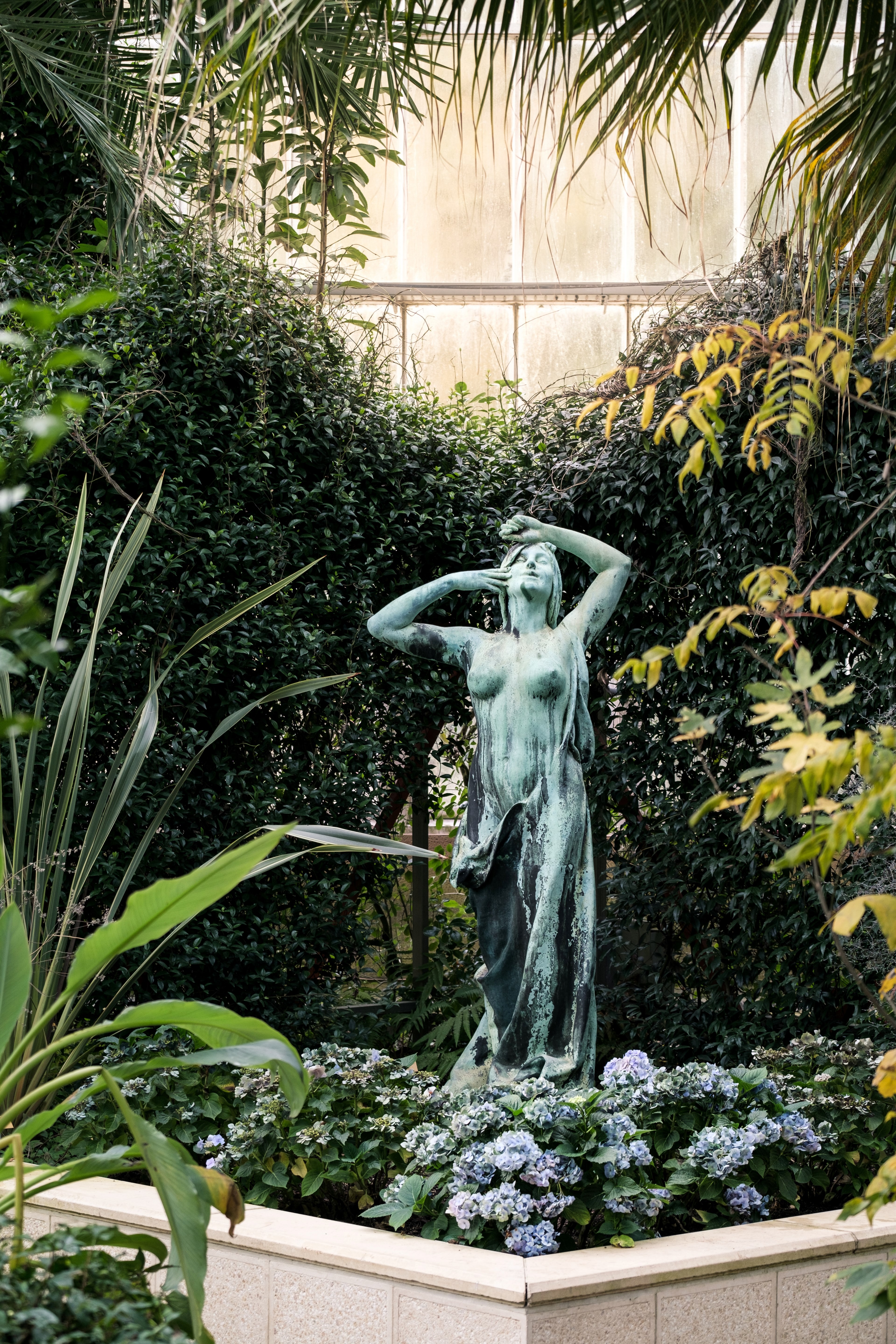 the figure of a women surrounded by lush greenery 4k, Phone HD Wallpaper