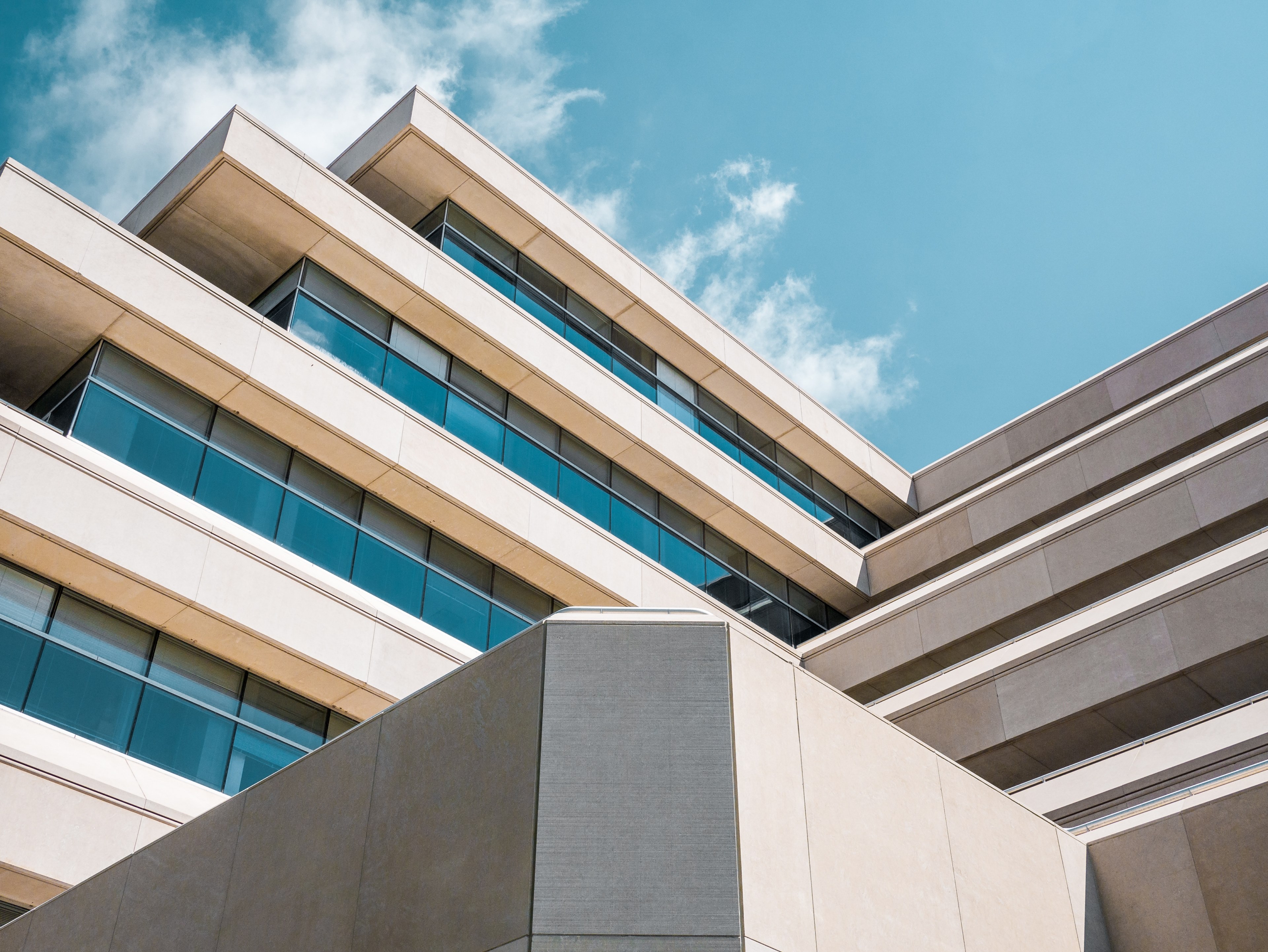 a corner in the facade of a modern office building, stepped architectural levels 4k, HD Wallpaper