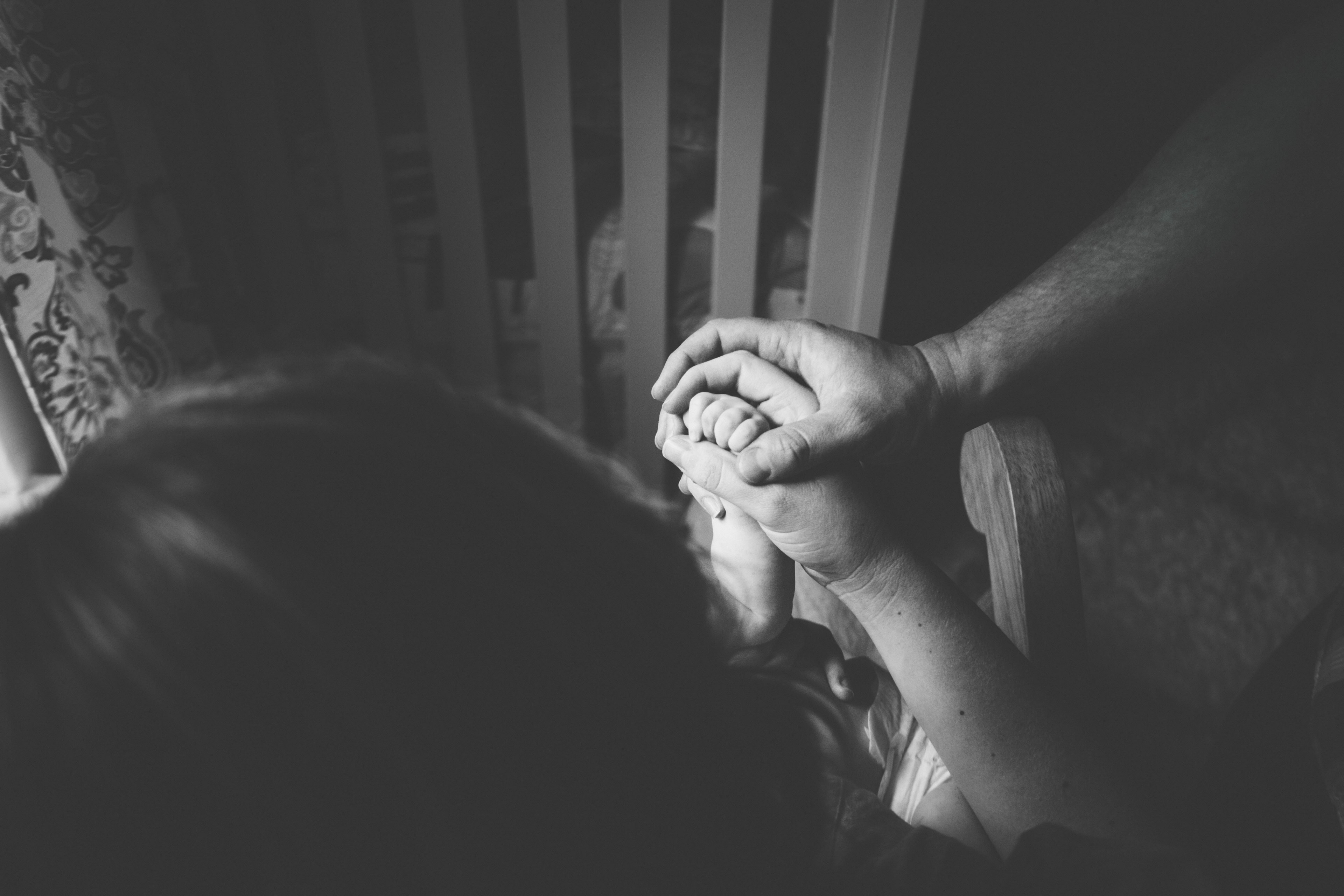 in black and white a couple holds hands while encircling their babys hand, _man woman child hands 4k, HD Wallpaper