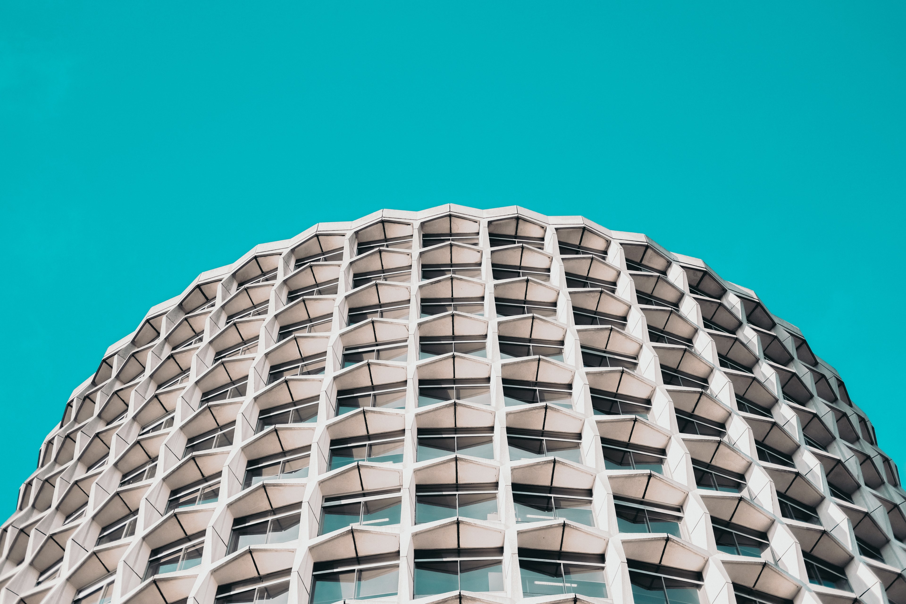 cruciform concrete blocks on the facade of a building under azure sky, modern living 4k, HD Wallpaper