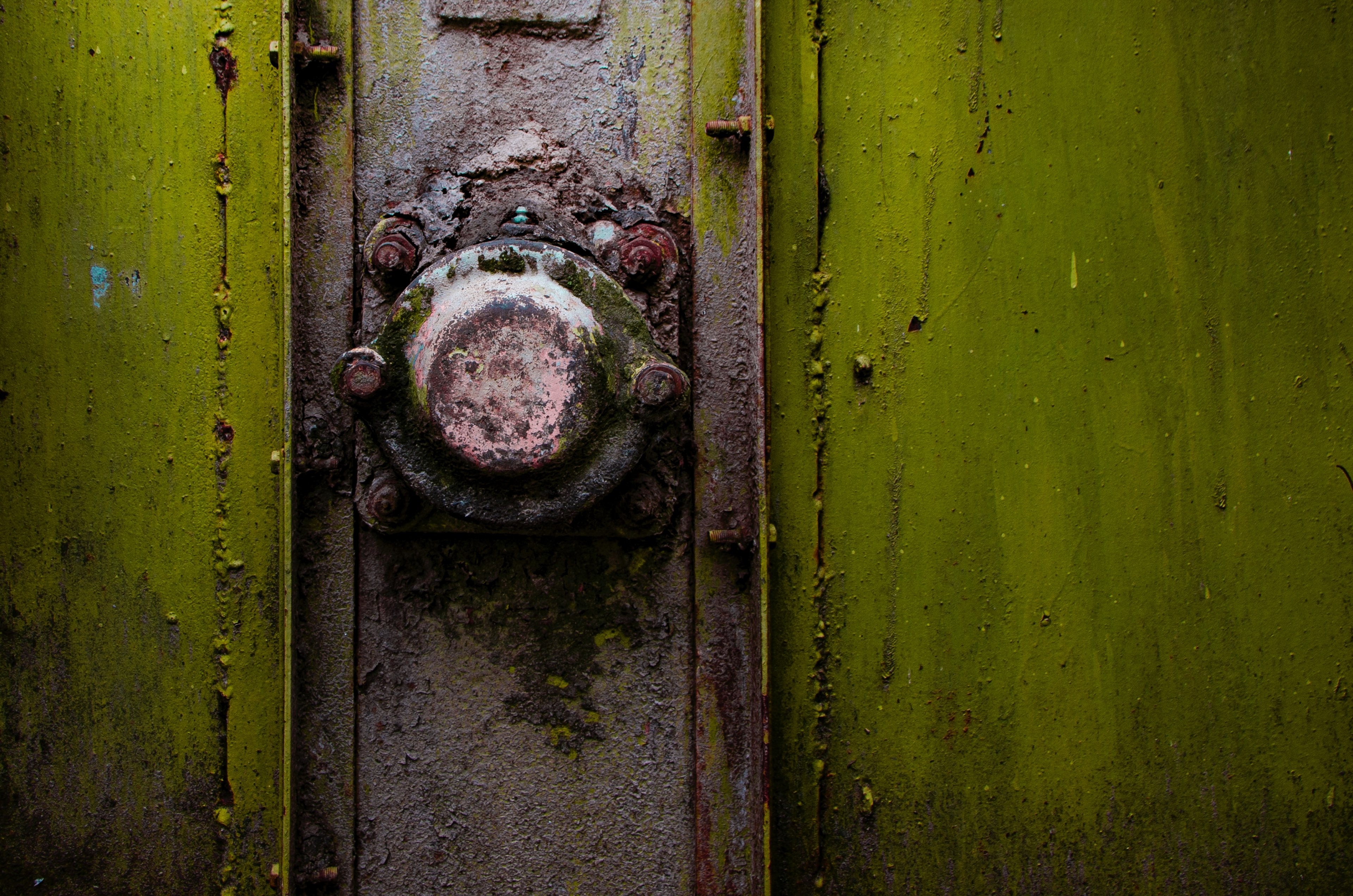 a close up of a rusty metal knob on a green strongbox, in to the green 4k, HD Wallpaper