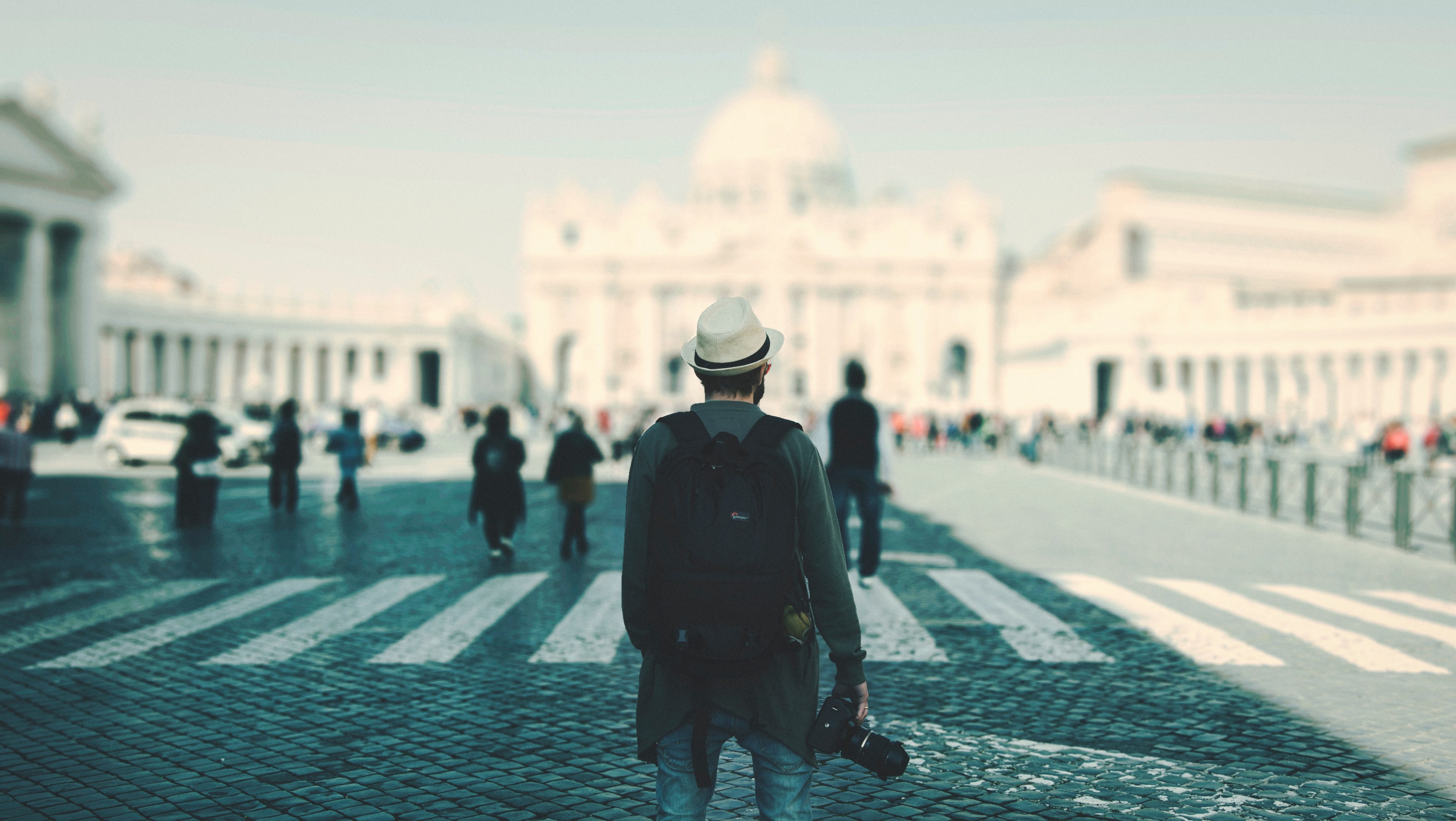 a backpacker with a camera standing in st_ peters square in vatican city, in roma 4k, HD Wallpaper