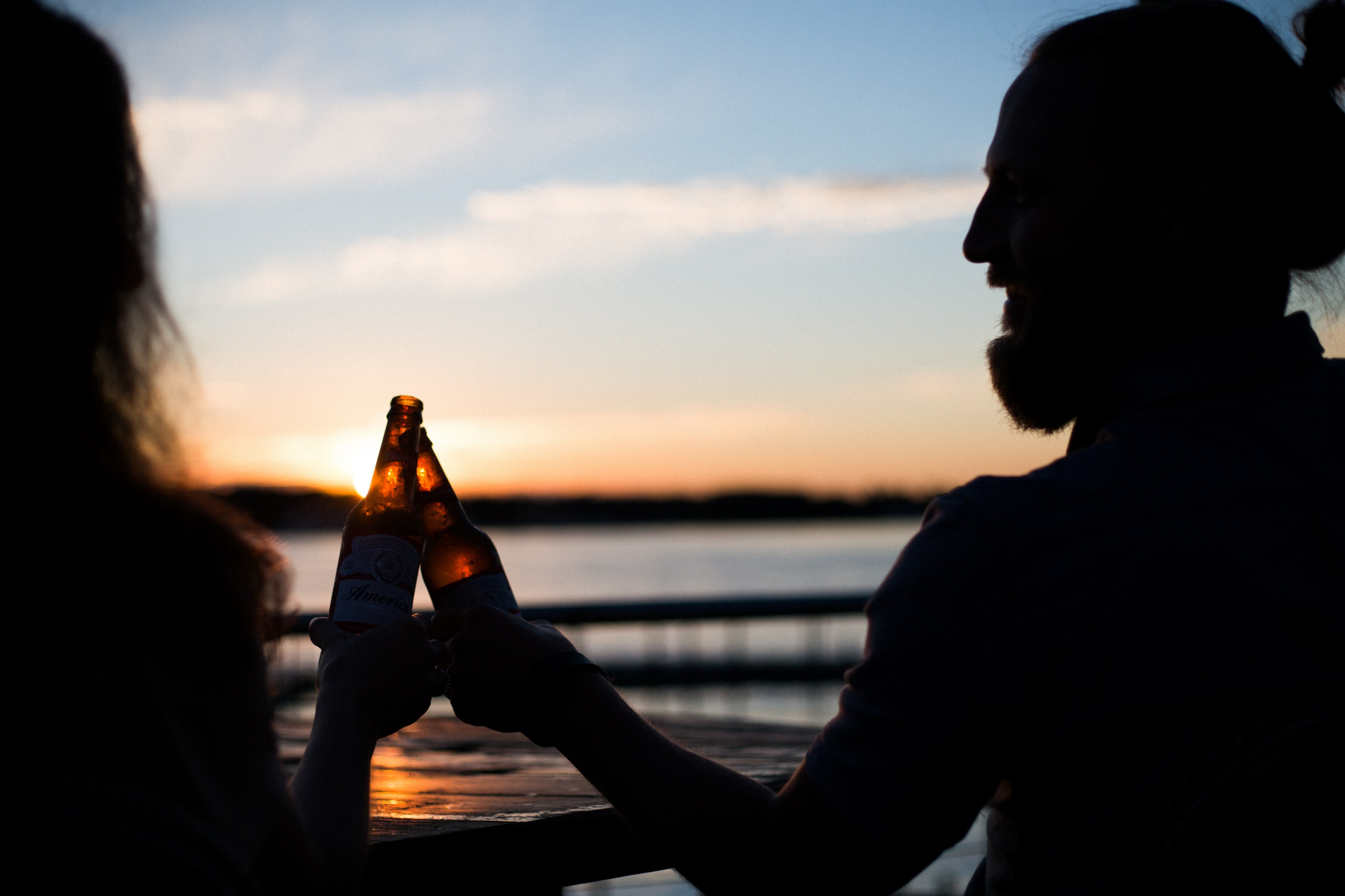 two couple relaxing and cheering in sunset by a lake in silhouette, cheers 4k, HD Wallpaper