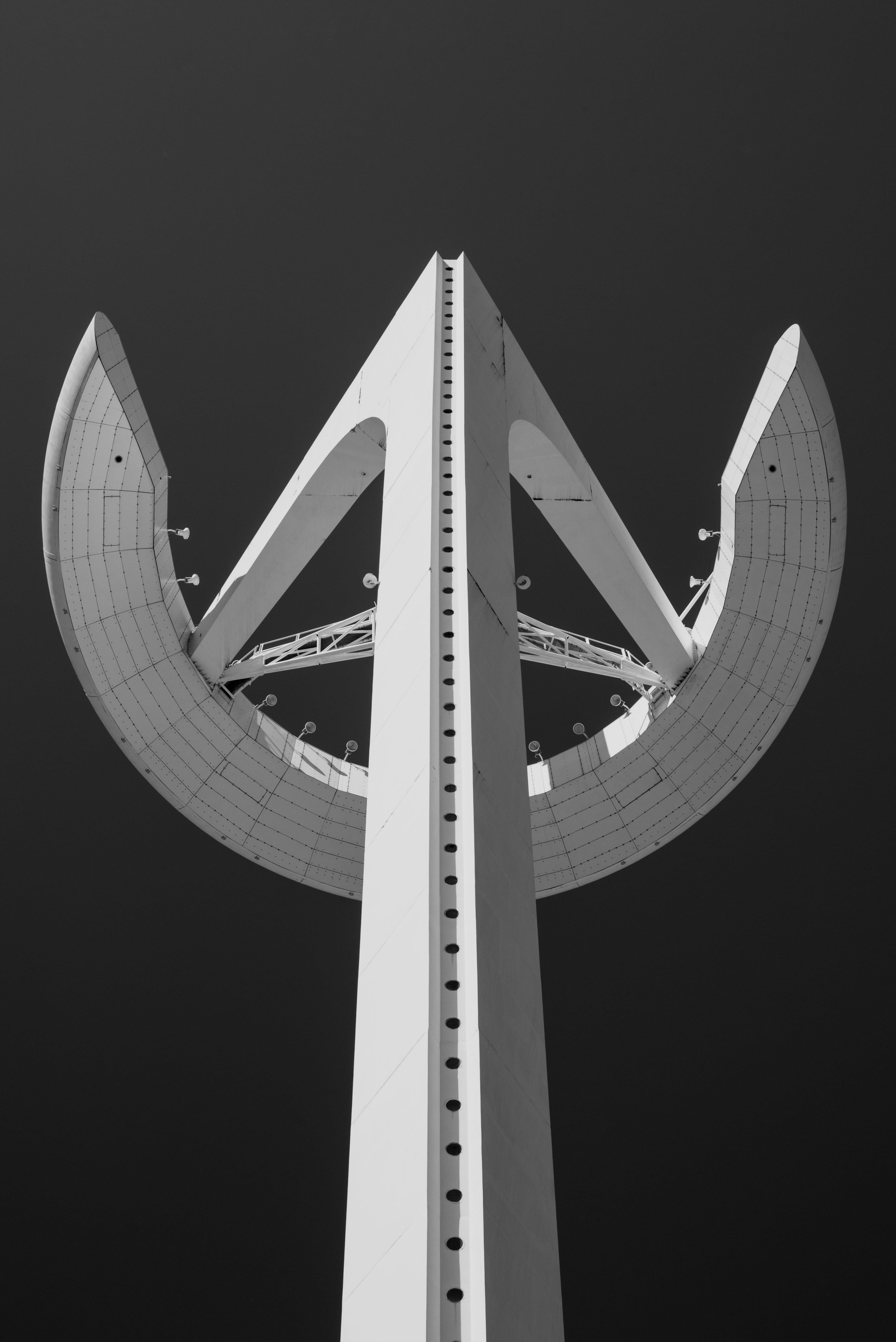 black and white shot of montjuc communications tower from below in barcelona, monochrome montjuc tower 4k, Phone HD Wallpaper