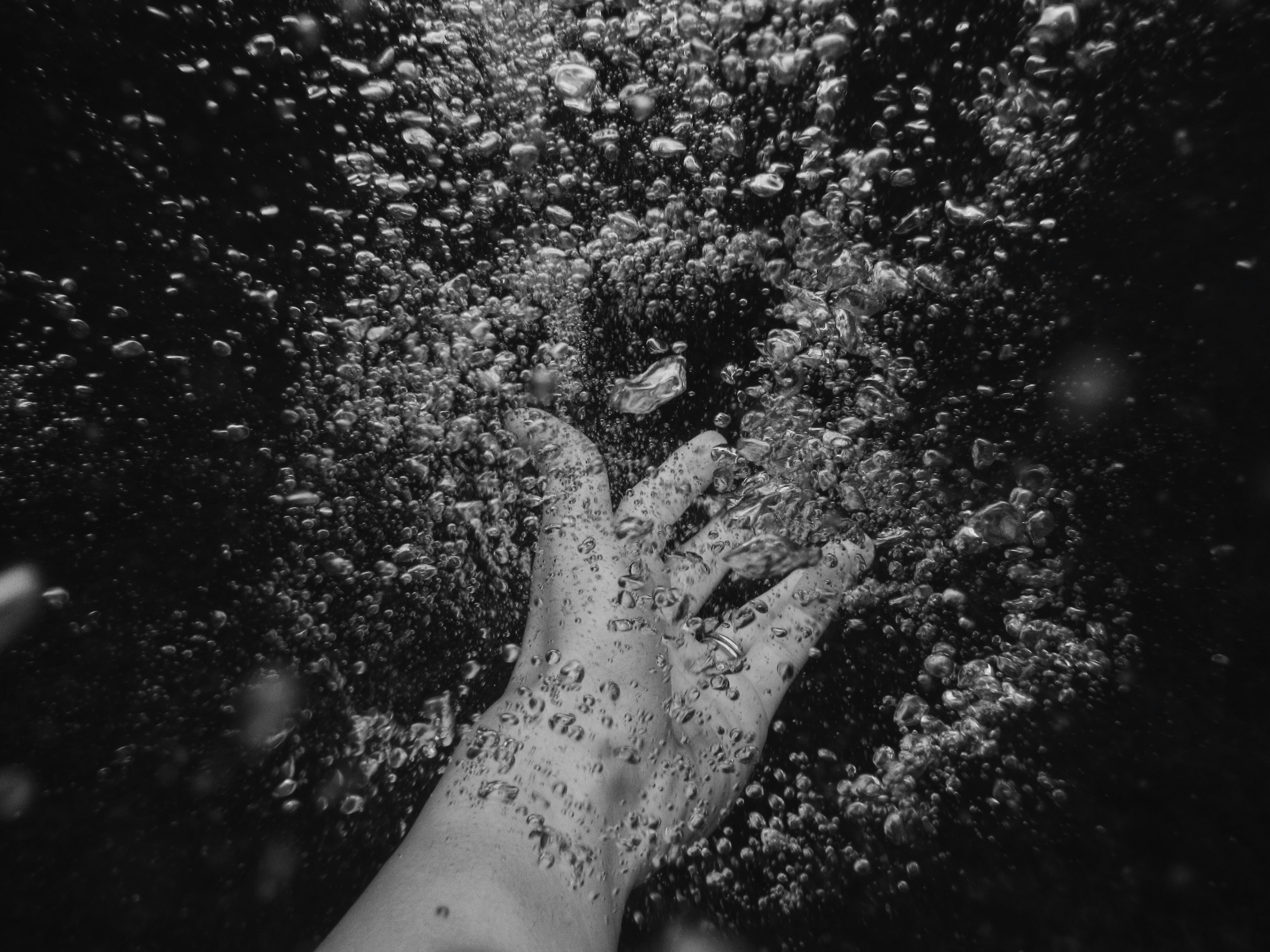a person moving their hand underwater in negril which makes bubbles, bubble hands 4k, HD Wallpaper