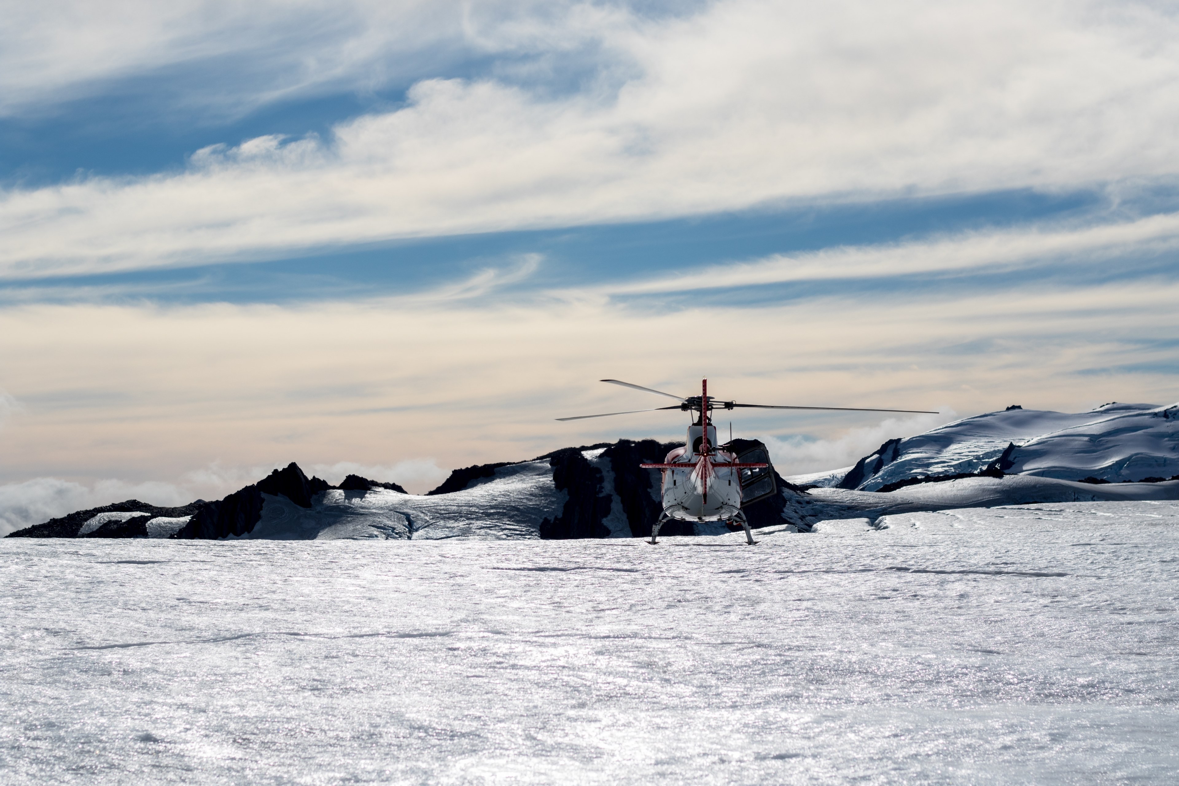 a helicopter sitting in a field of snow at fox glacier in new zealand, helicopter out in snow 4k, HD Wallpaper