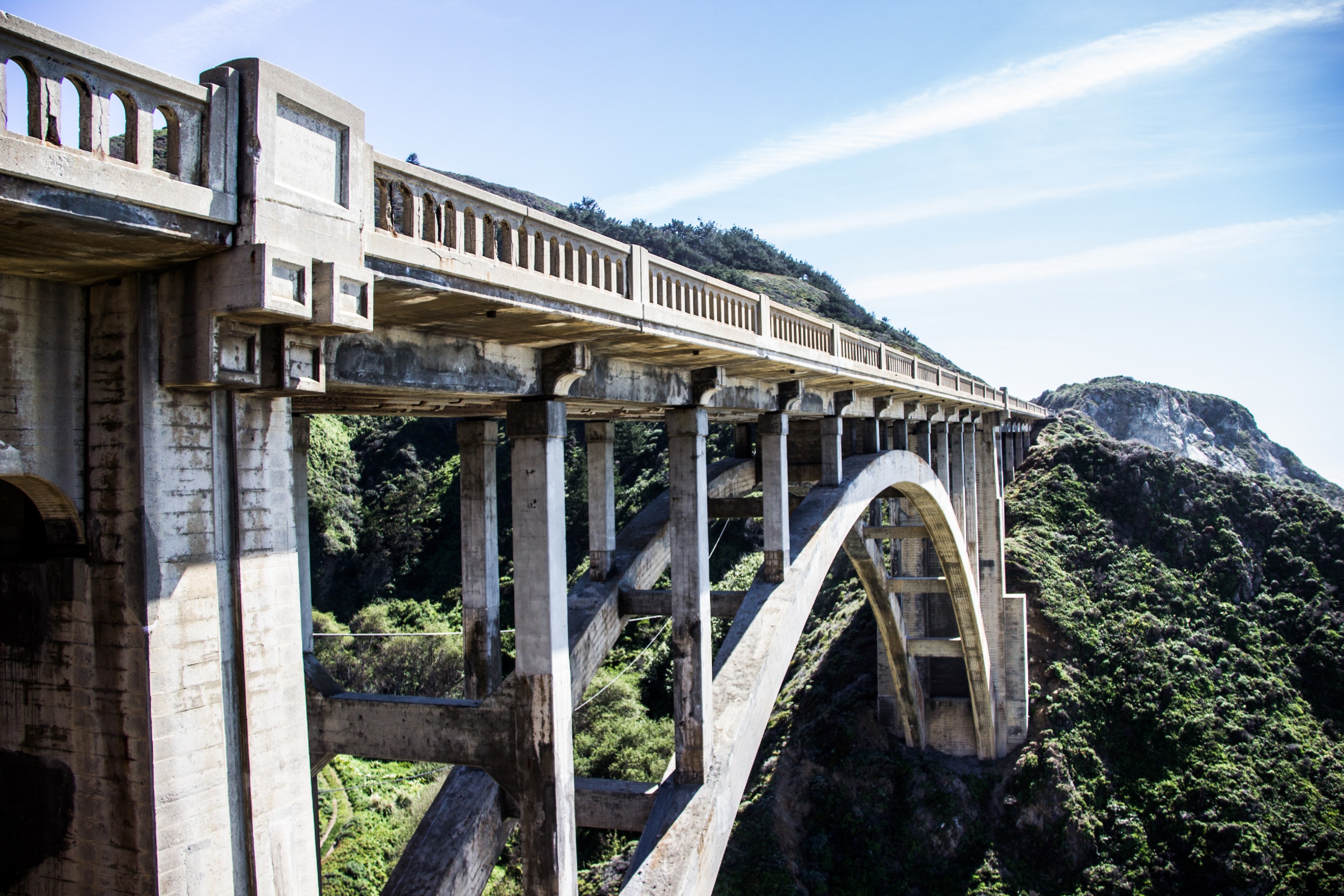 the side of a massive concrete bridge in a mountainous area, imposing concrete bridge 4k, HD Wallpaper