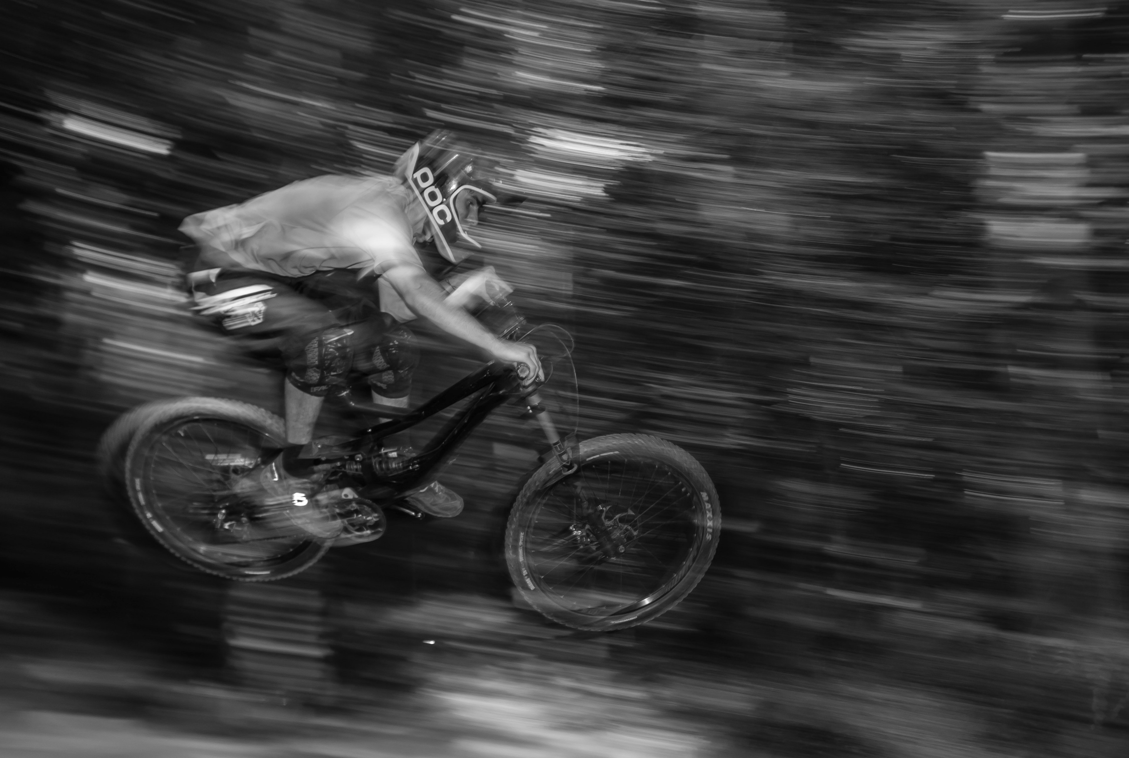 a mountain biker wearing a helmet and knee pads jumping through the air on his bike, mountain biker 4k, HD Wallpaper