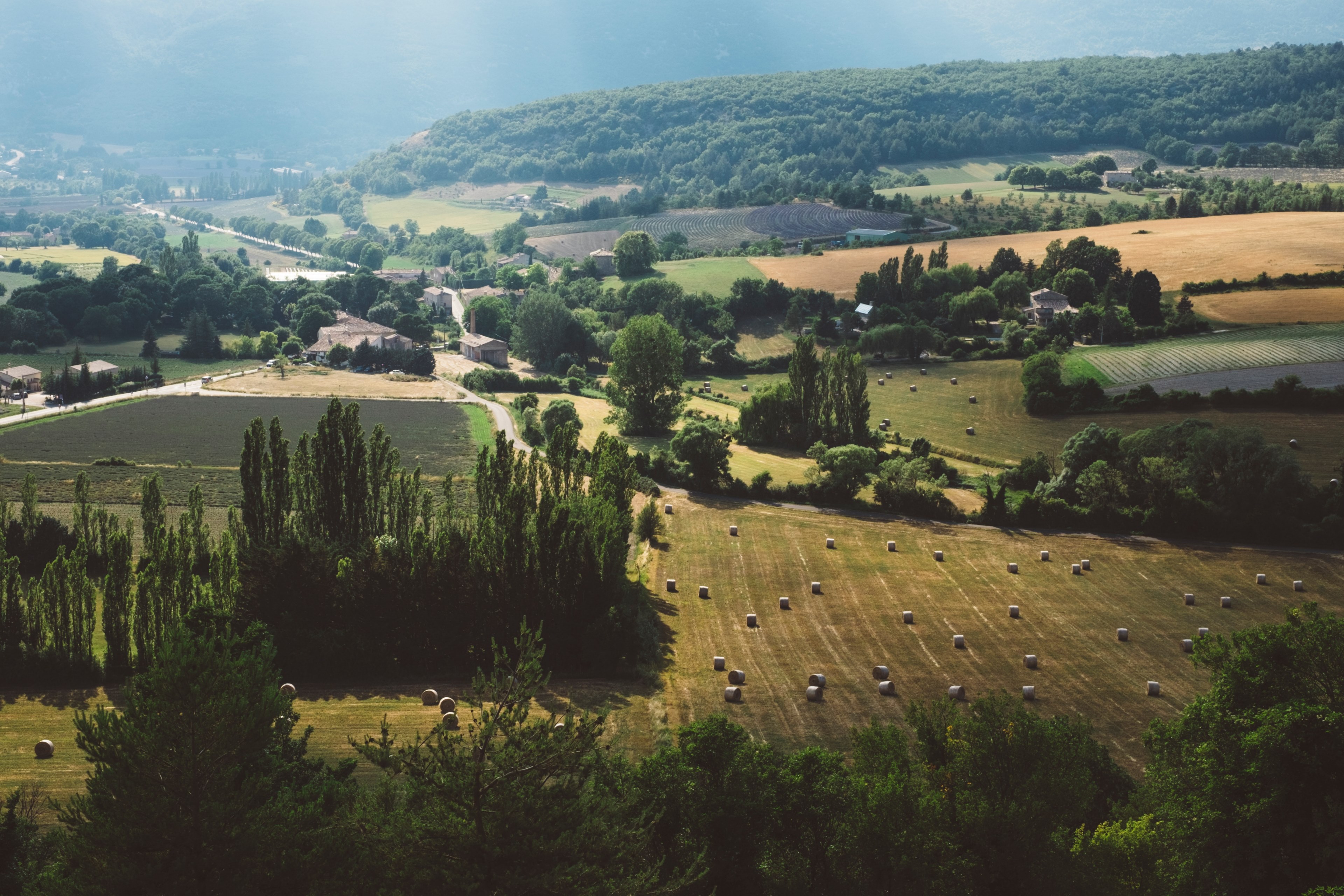 a rural landscape with hay bales in fields, serene countryside 4k, HD Wallpaper