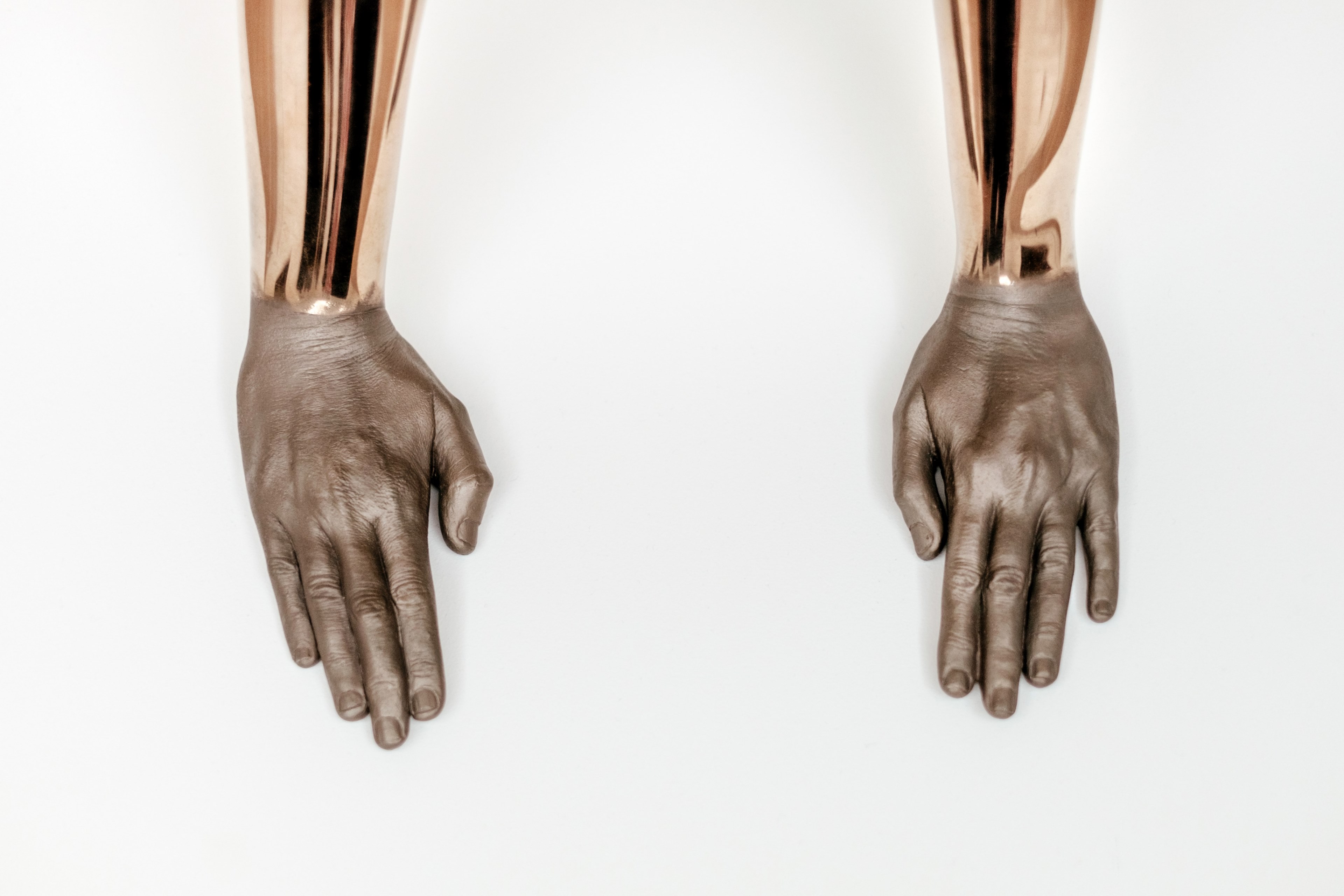 sculpture of golden arms and human hands resting on a white surface in fundaco serralves, golden arms in fundaco serralves 4k, HD Wallpaper