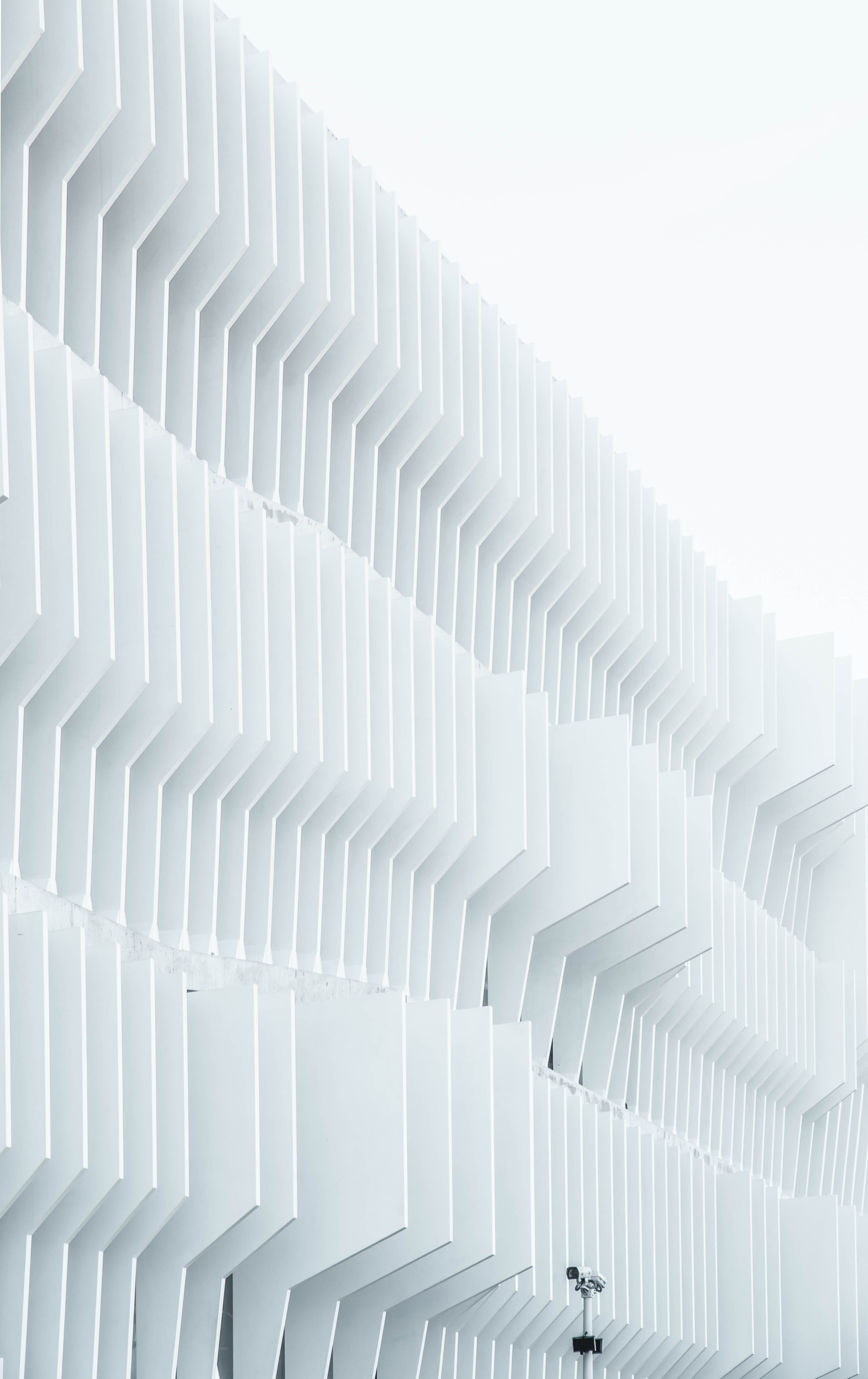 a security camera near parallel white ribs in a building facade in madrid, security camera near a facade 4k, Phone HD Wallpaper