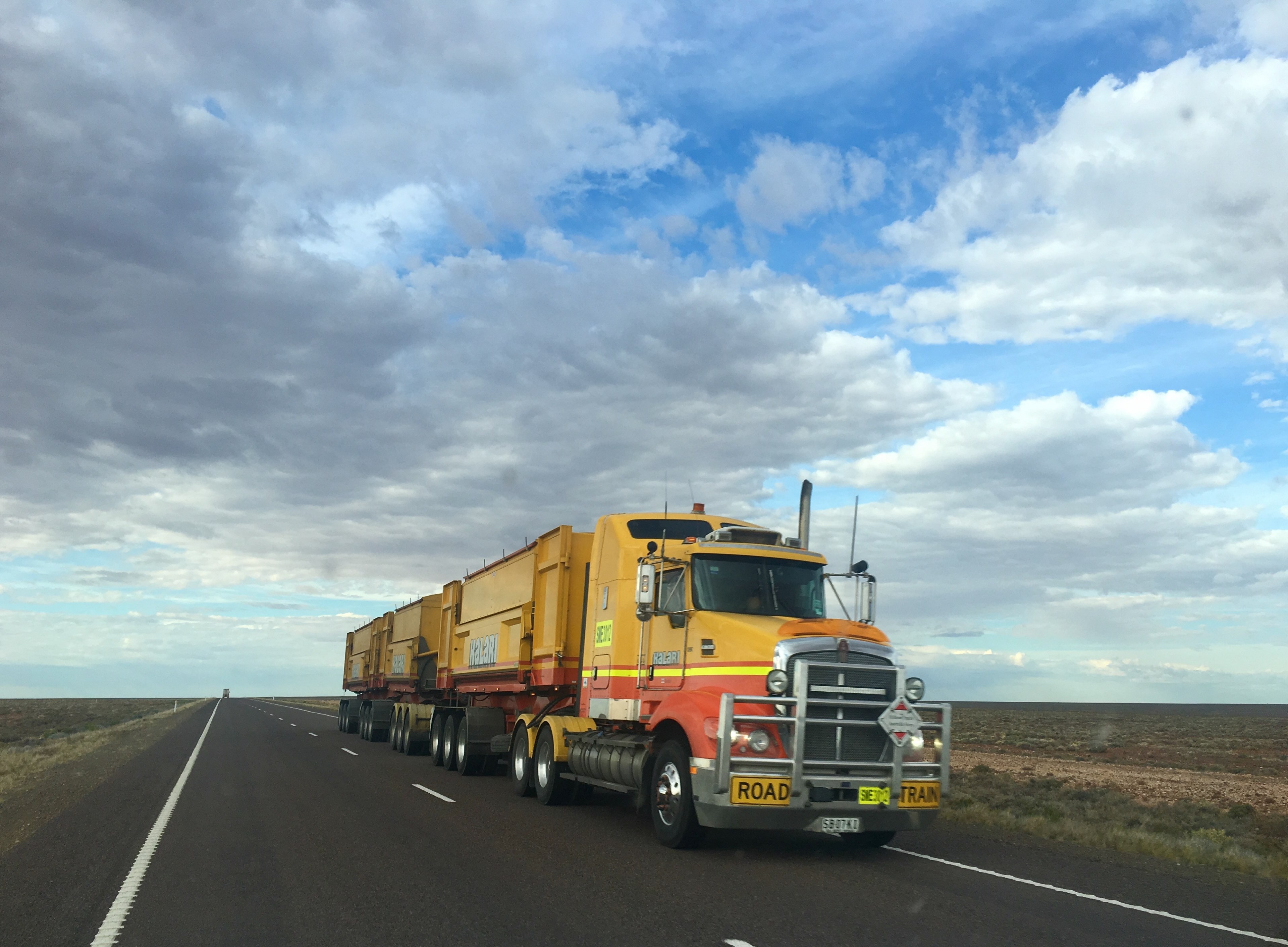 a truck with the containers cruising down a highway under a partially cloudy sky, _kalari to olympic dam 4k, HD Wallpaper