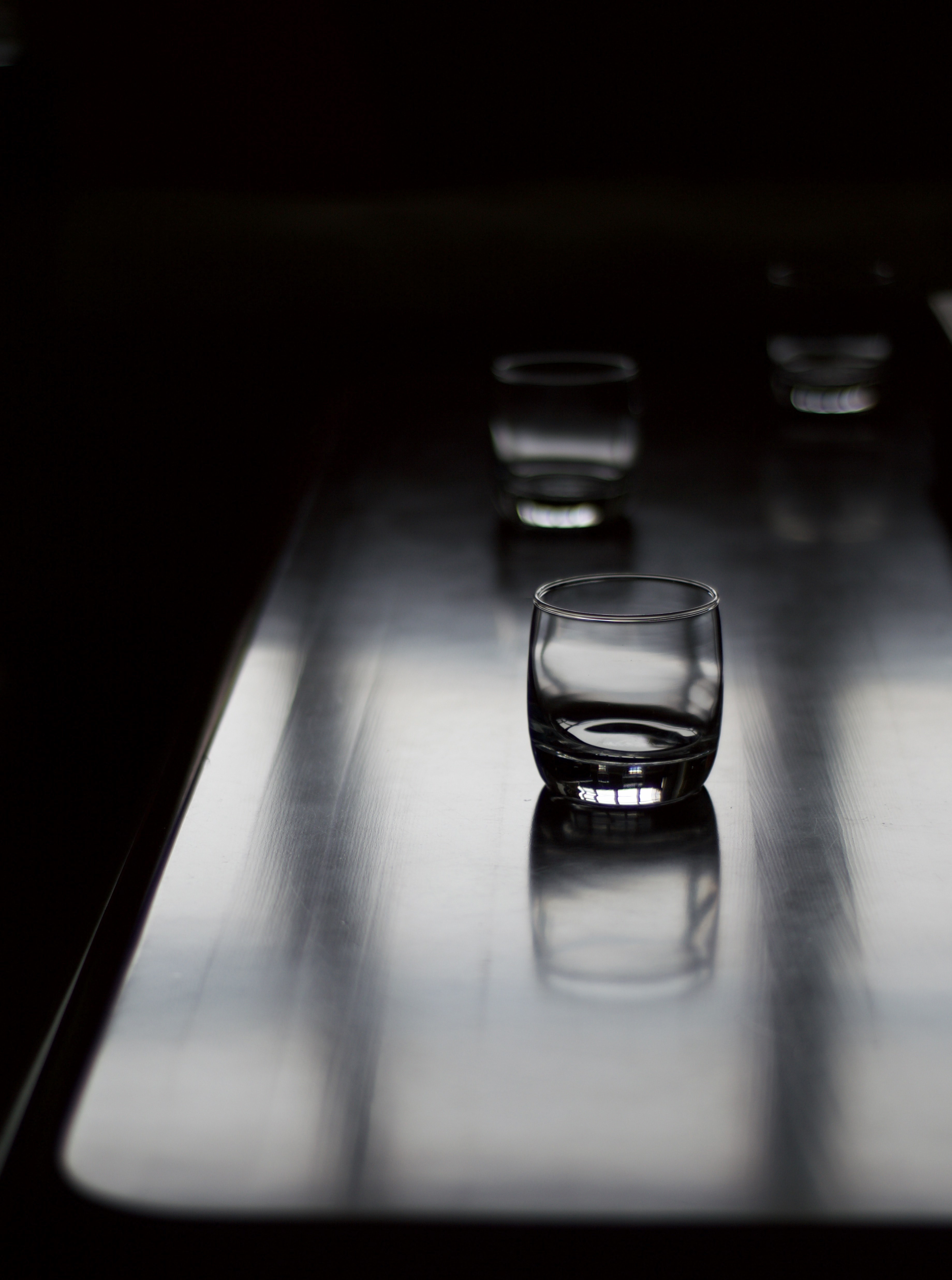 wooden table with three old fashioned glasses, glasses on table 4k, Phone HD Wallpaper