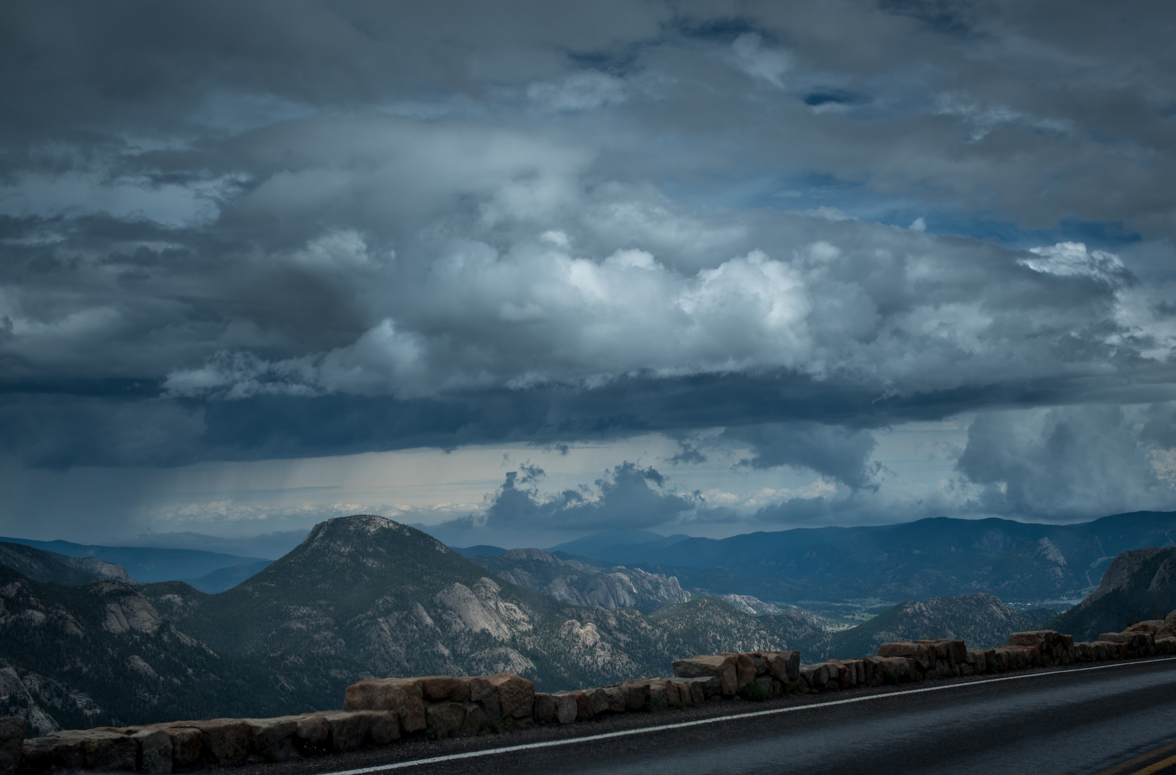 view from an asphalt road on a mountain valley under thick gray clouds, driving in the mountains 4k, HD Wallpaper