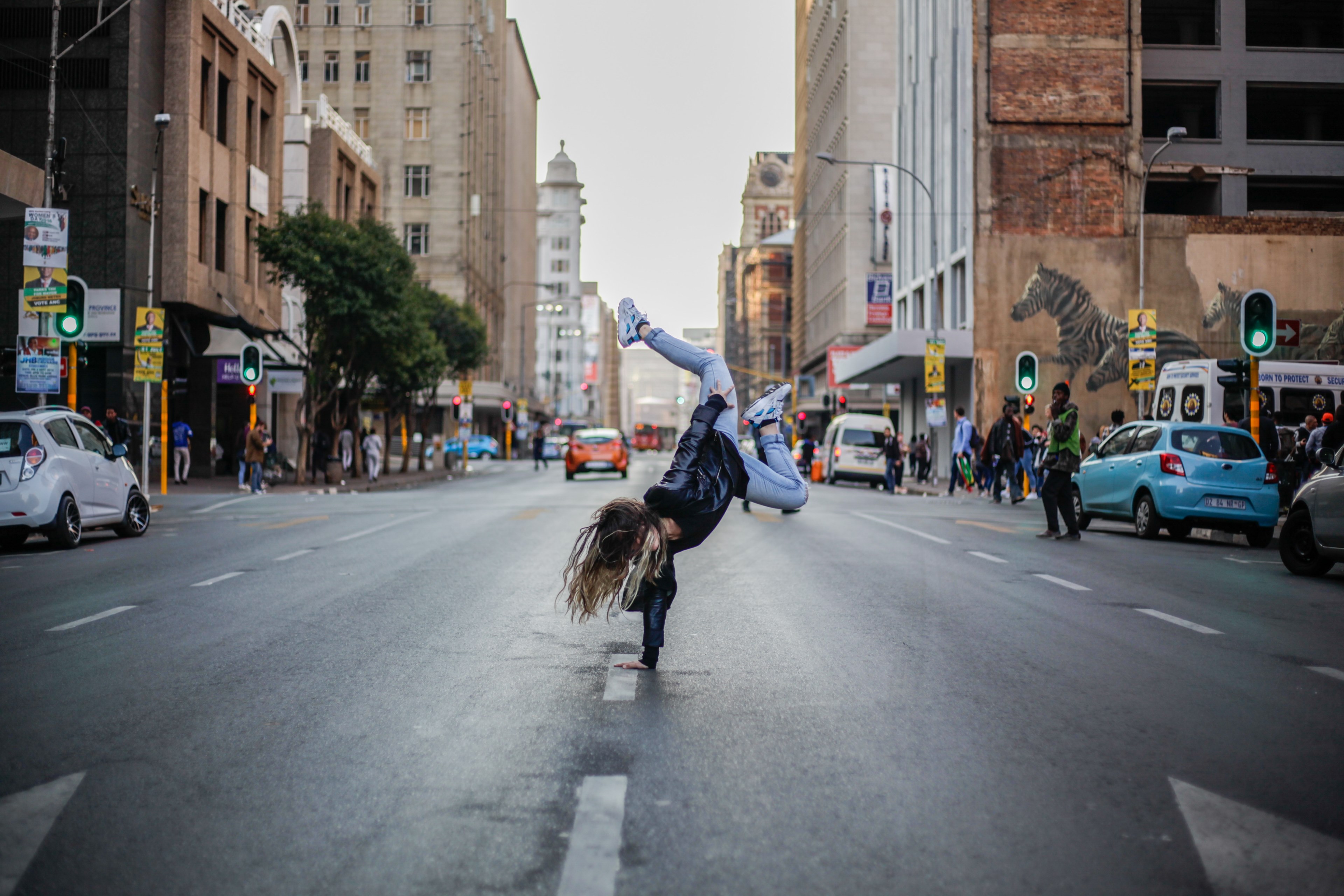 a woman doing a single handed handstand in the middle of the street, _dance 4k, HD Wallpaper