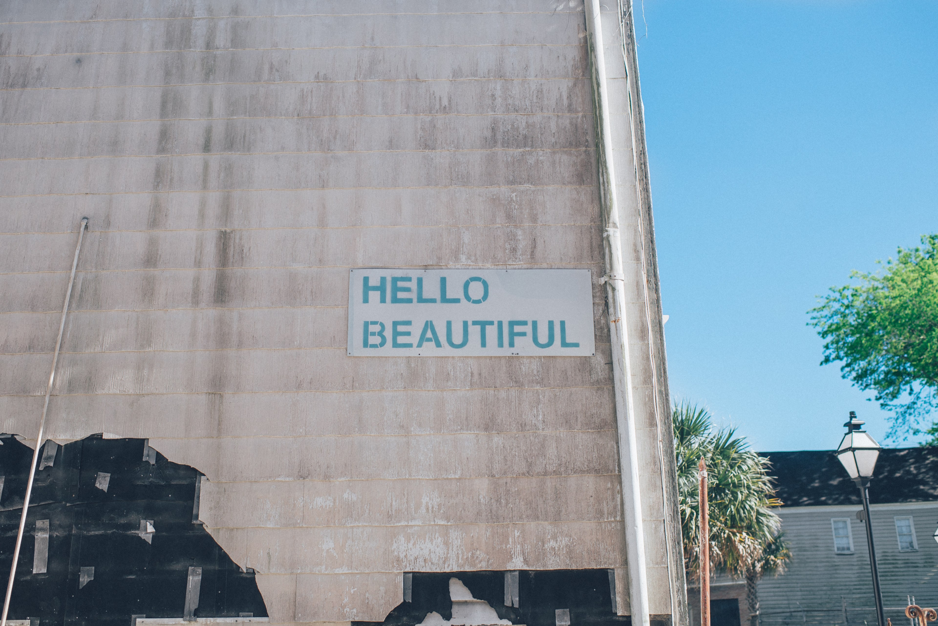 green hello beautiful sign on urban wall with blue sky in background charleston, hello beautiful sign on building 4k, HD Wallpaper