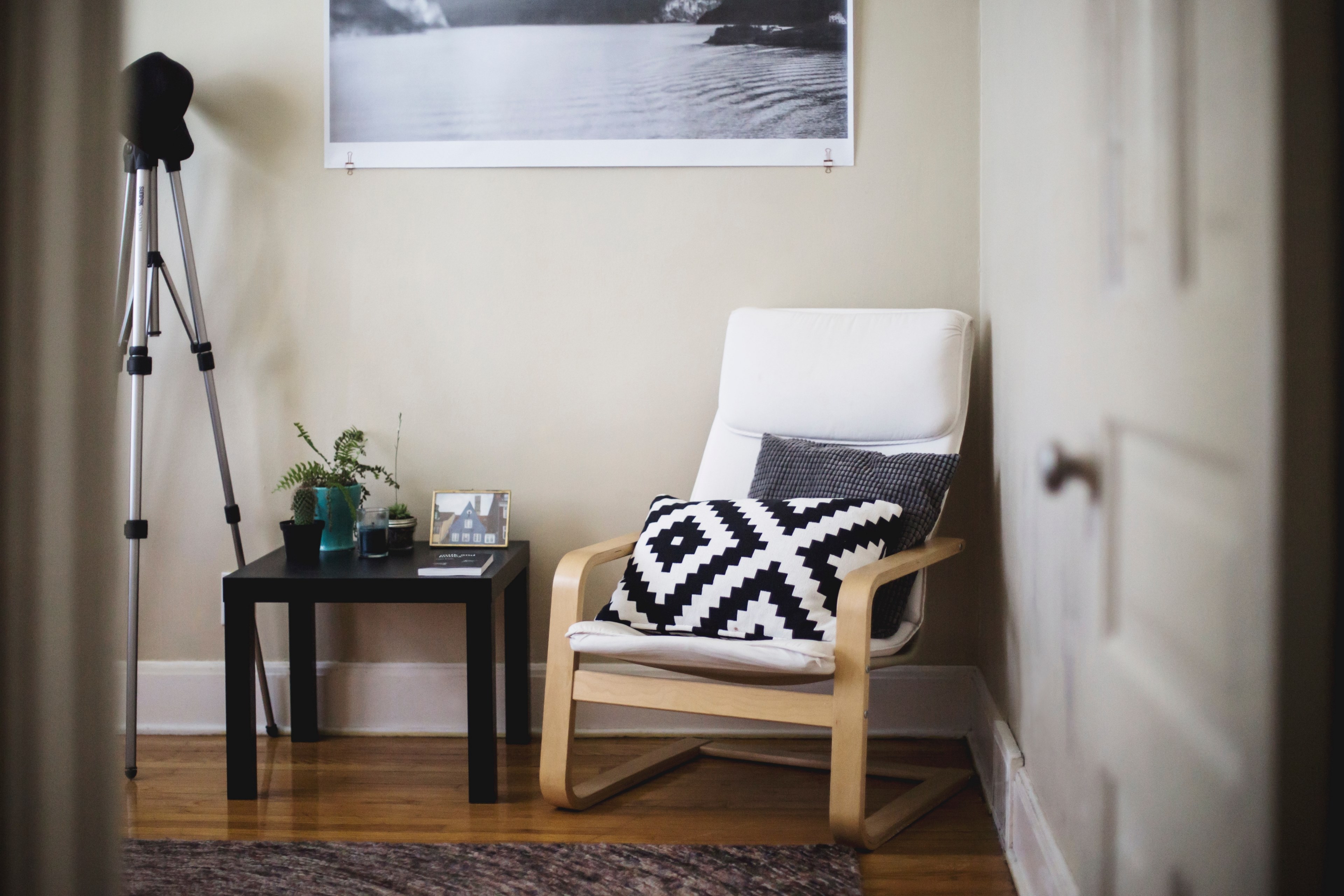 a chair with two pillows next to a coffee table in the corner of a room, home sweet home pt_ 6 4k, HD Wallpaper