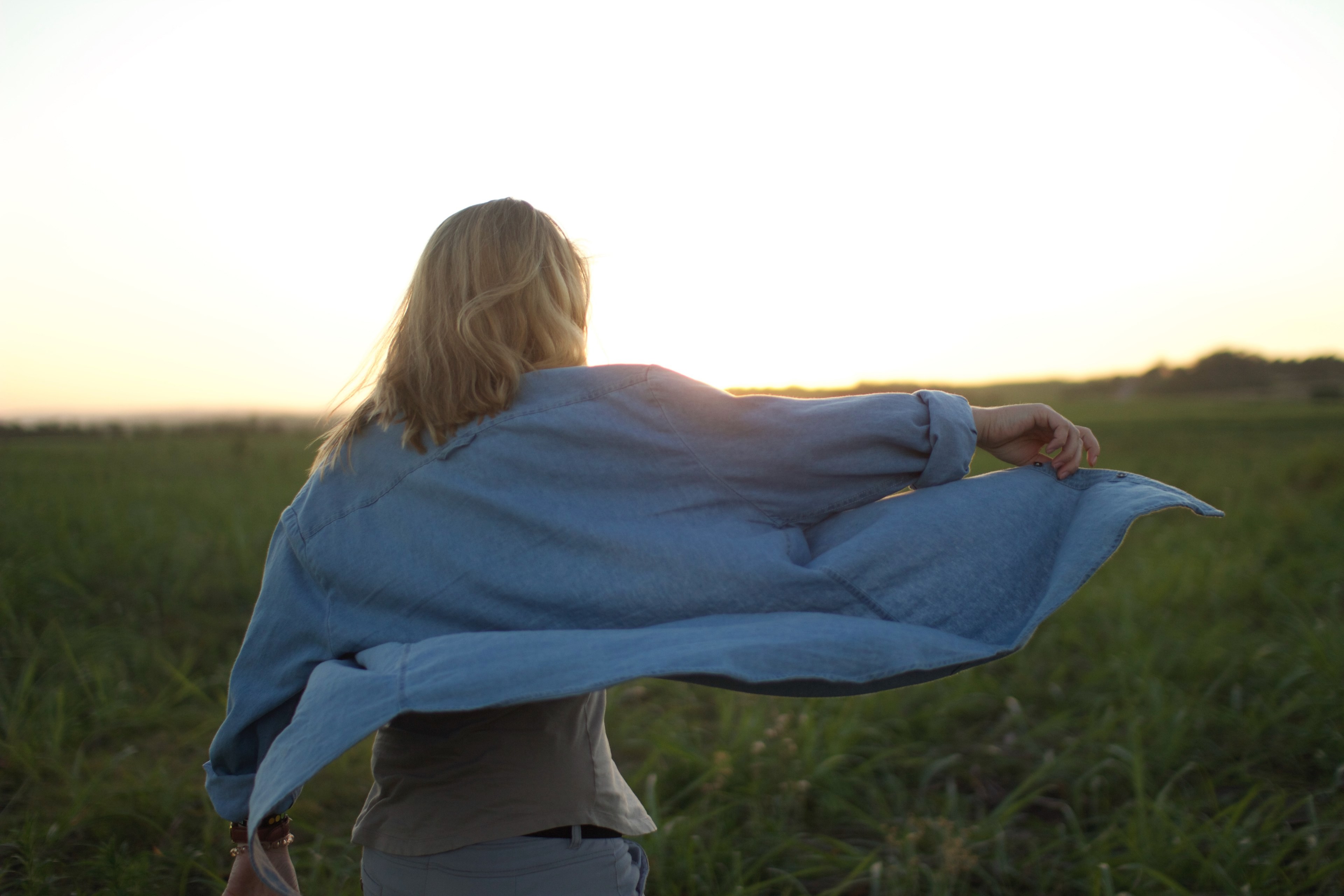 woman in a blue shirt against a sunset in a field at salt rock, woman at salt rock_ 4k, HD Wallpaper