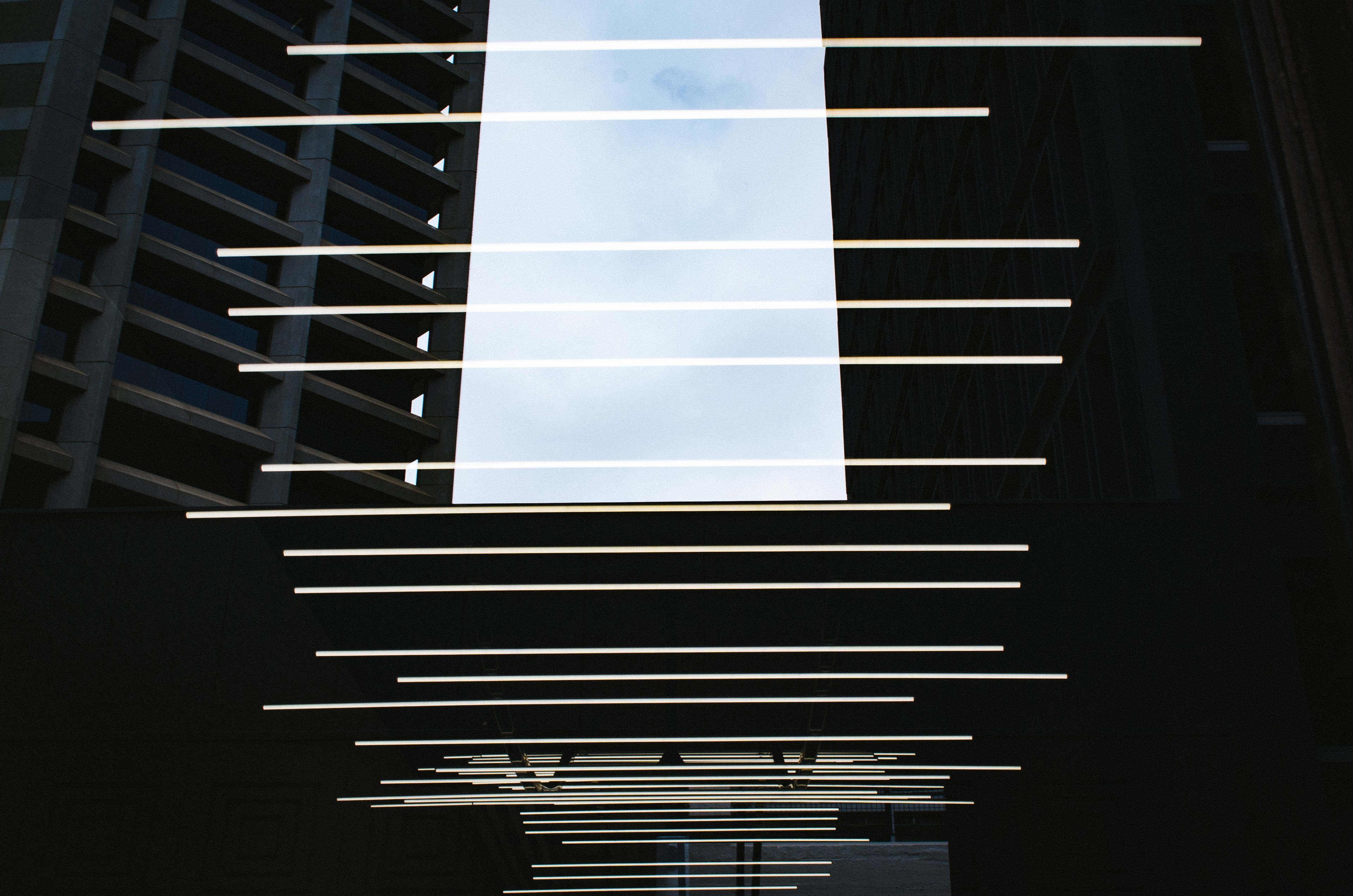 rows of light beams above a walkway between buildings, _light beams rows buildings 4k, HD Wallpaper