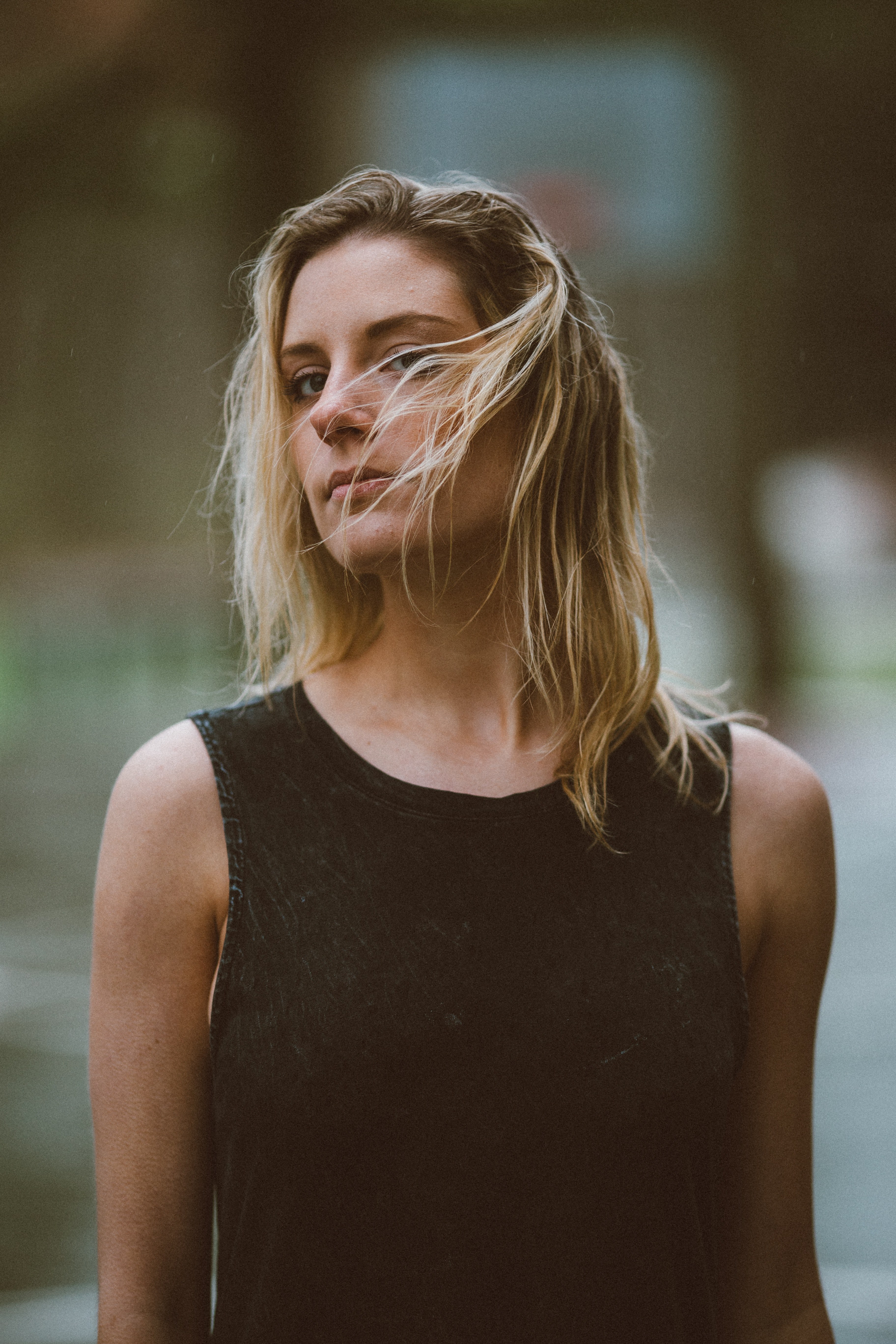wind blows a womans hair into her face as she stands confidently, windy windy 4k, Phone HD Wallpaper