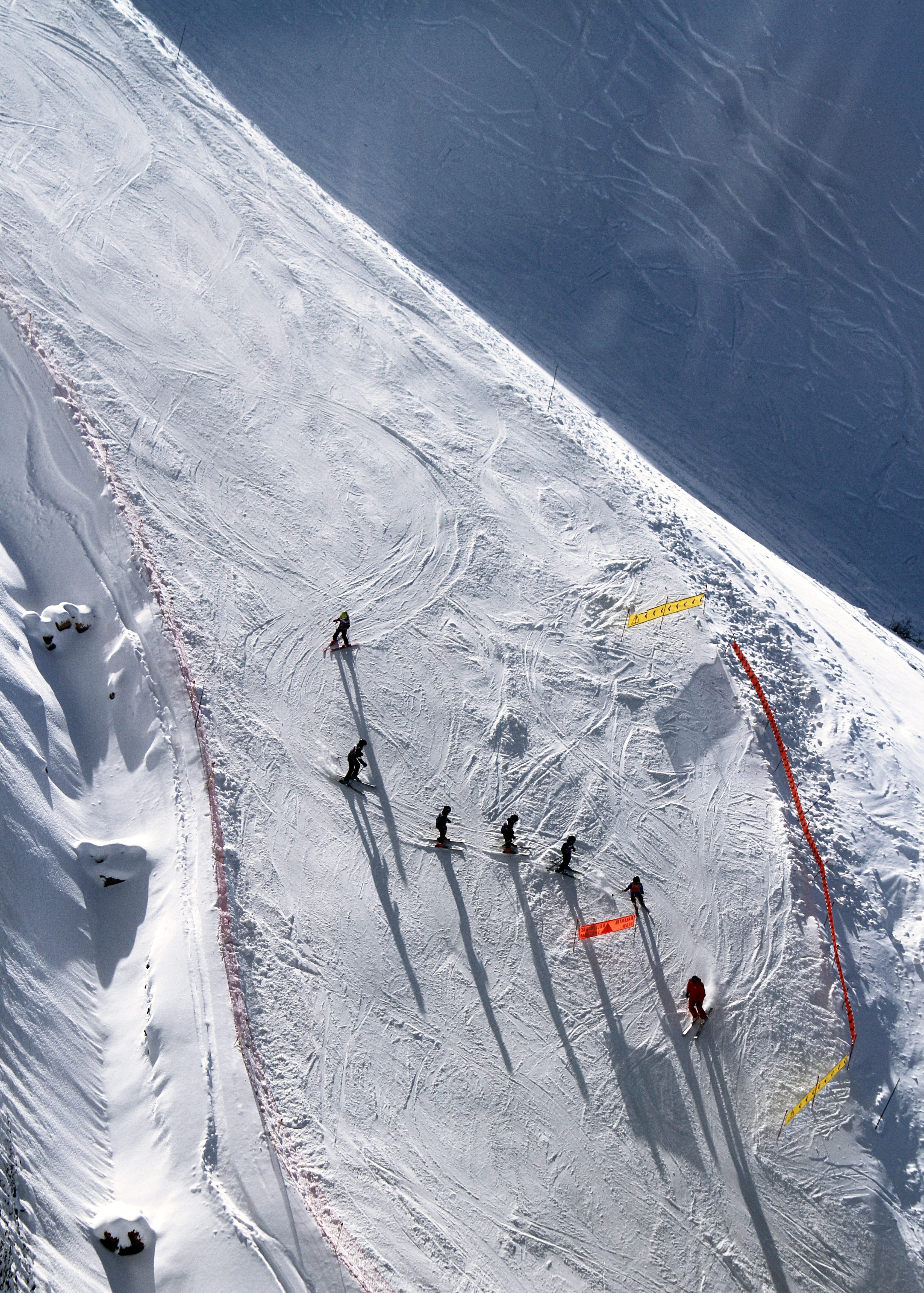 a drone shot directly above seven skiers preparing for a slope race, ski racers 4k, Phone HD Wallpaper