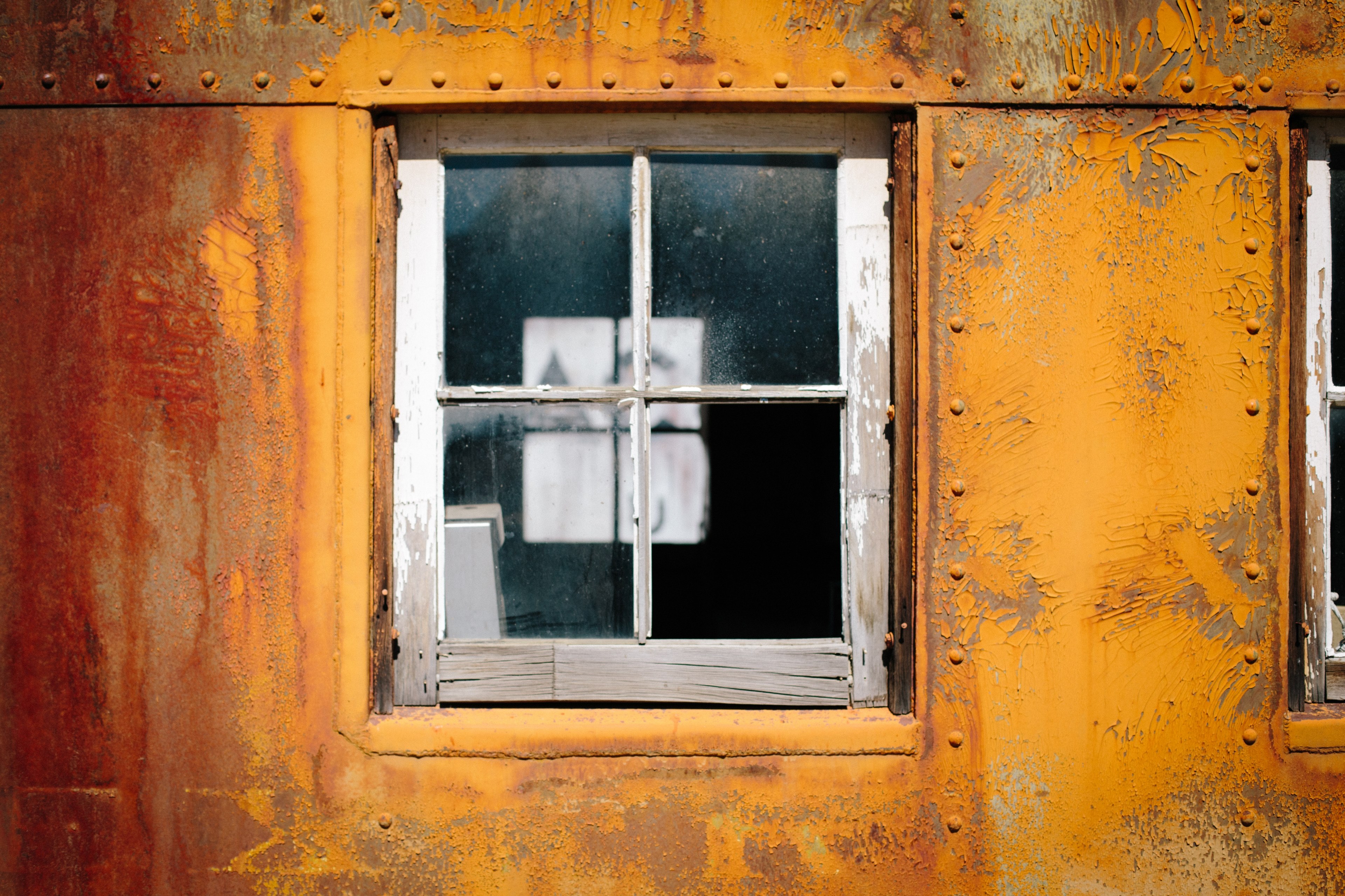 the close up view of a glass window of a rusty and old metal building in western pacific railroad museum, glass window on building_ 4k, HD Wallpaper