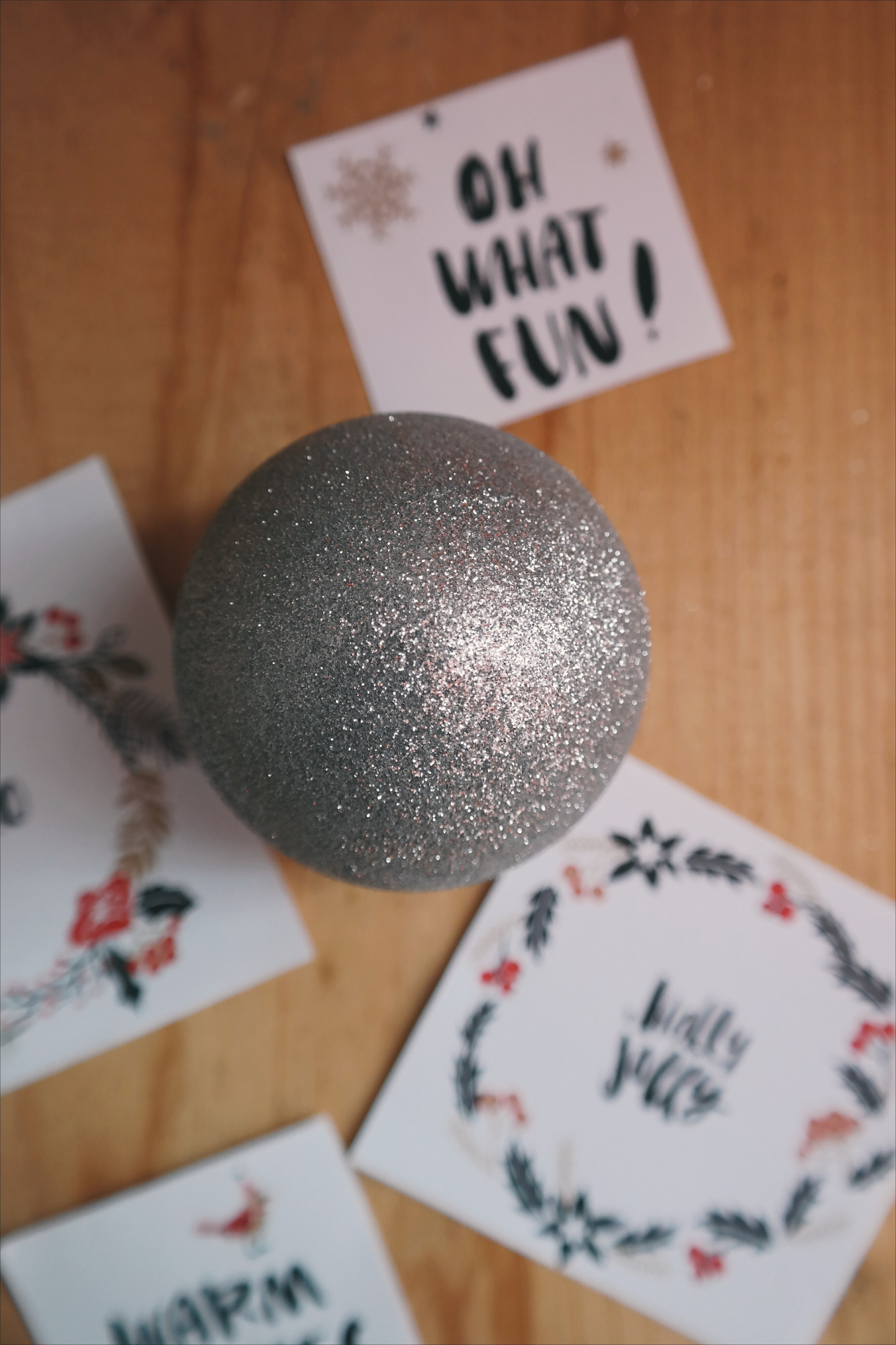 a gray christmas ornament sitting on the floor next to little notes, _gray xmas ornament 4k, Phone HD Wallpaper