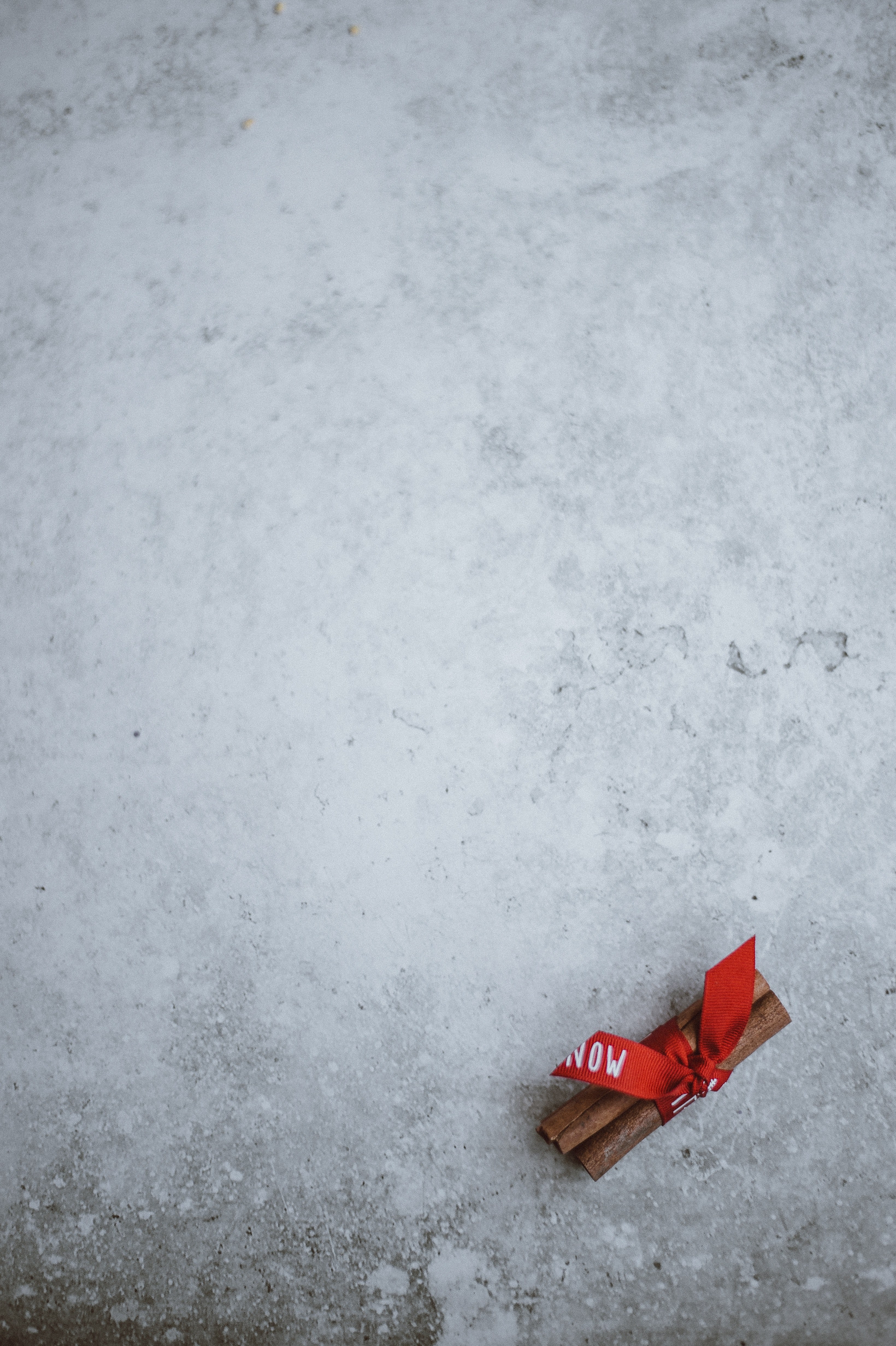 cinnamon stick wrapped in festive ribbon 4k, Phone HD Wallpaper