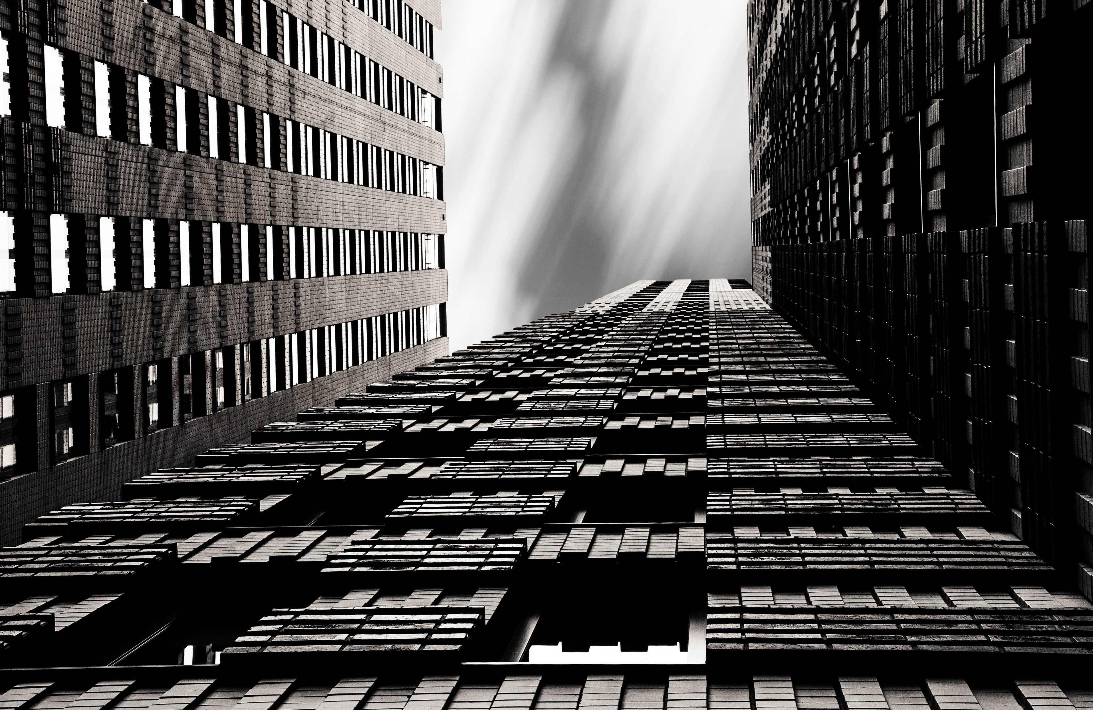 a black and white shot of skyscrapers with geometric patterns facade, _city skyscraper architecture 4k, HD Wallpaper