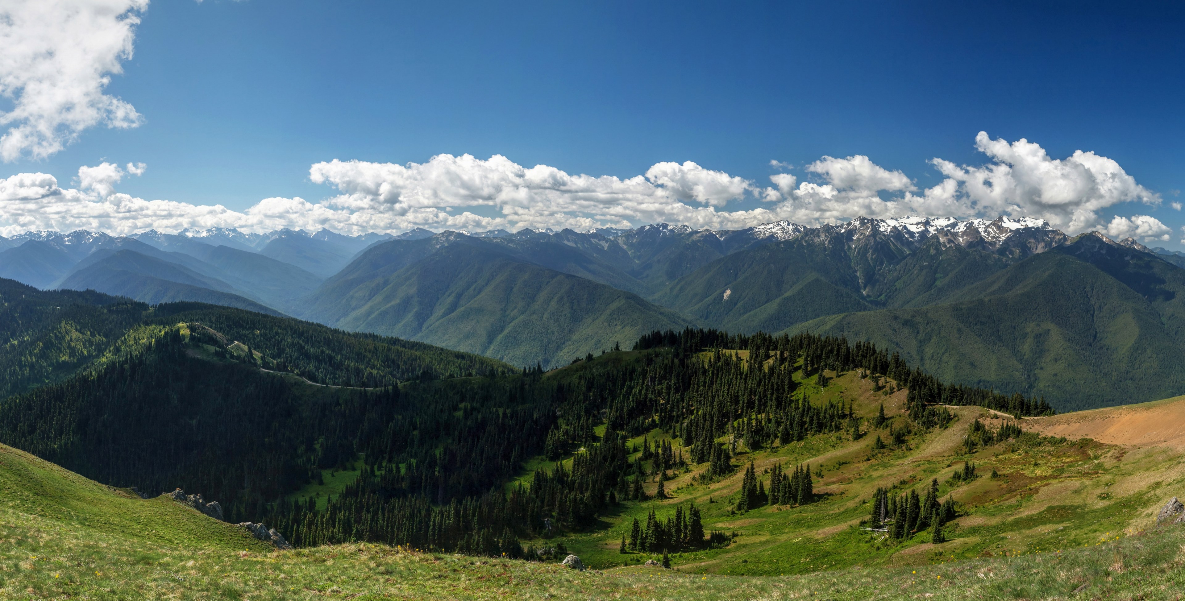 green mountains with snow topped crests under fluffy clouds, snow on green mountains 4k, HD Wallpaper