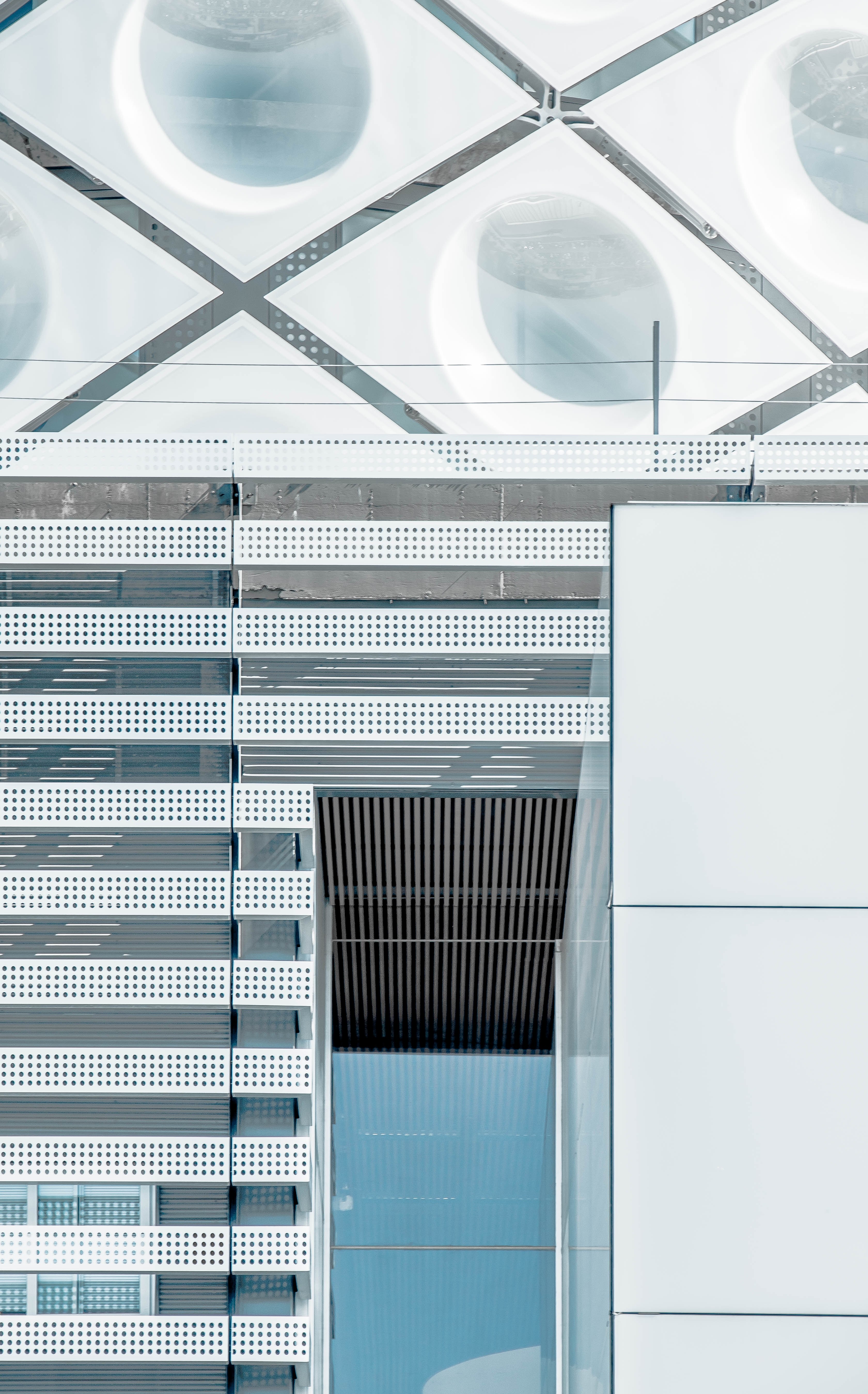 the exterior of an office building in madrid with a glass door and geometric shapes on the facade, madrid entrance 4k, Phone HD Wallpaper