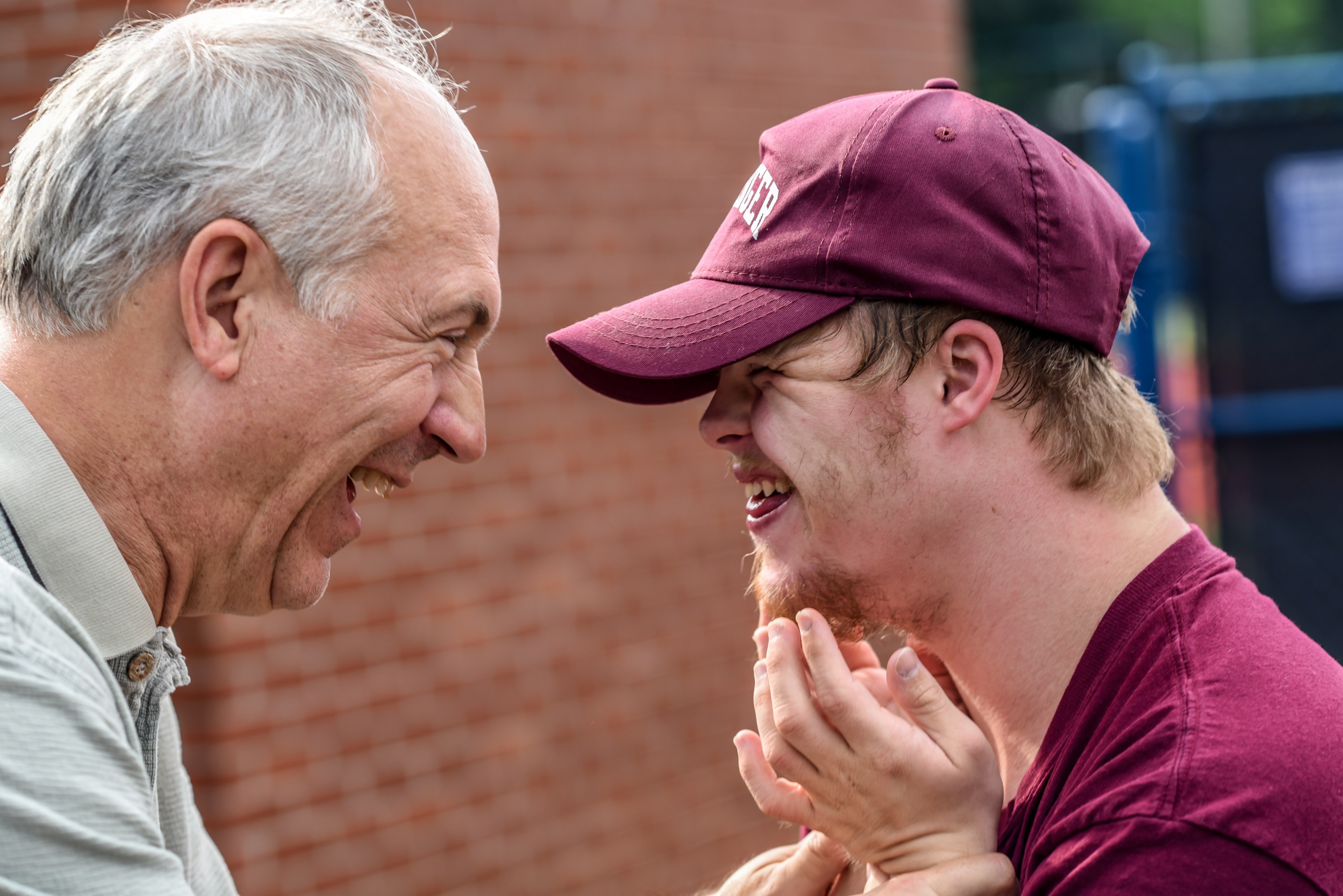 old man and teenage boy in baseball cap share a moment of joy and laughter, moment of laughter 4k, HD Wallpaper