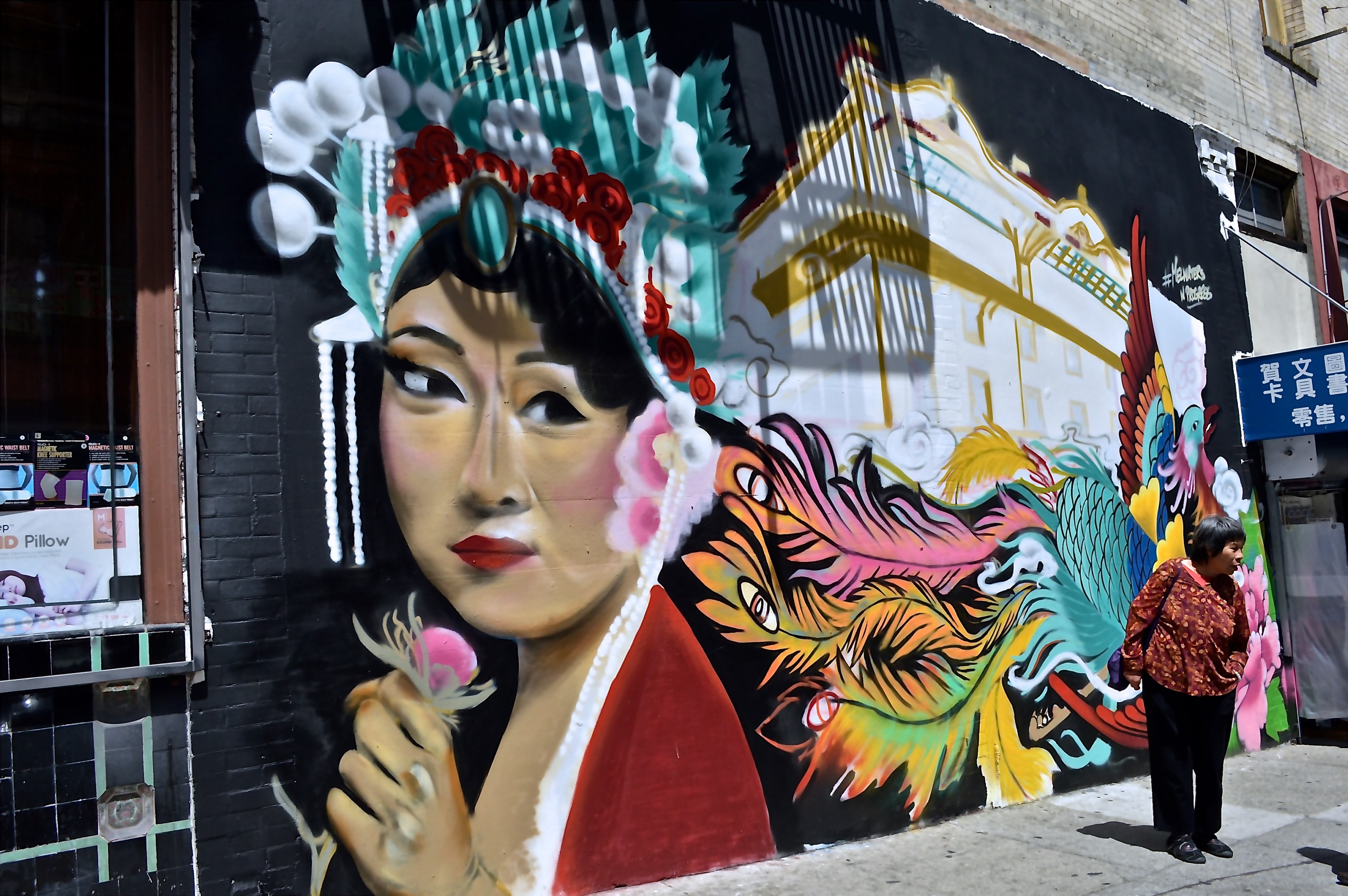 an asian woman holding a flower painted on a wall, _asian woman wall painting 4k, HD Wallpaper