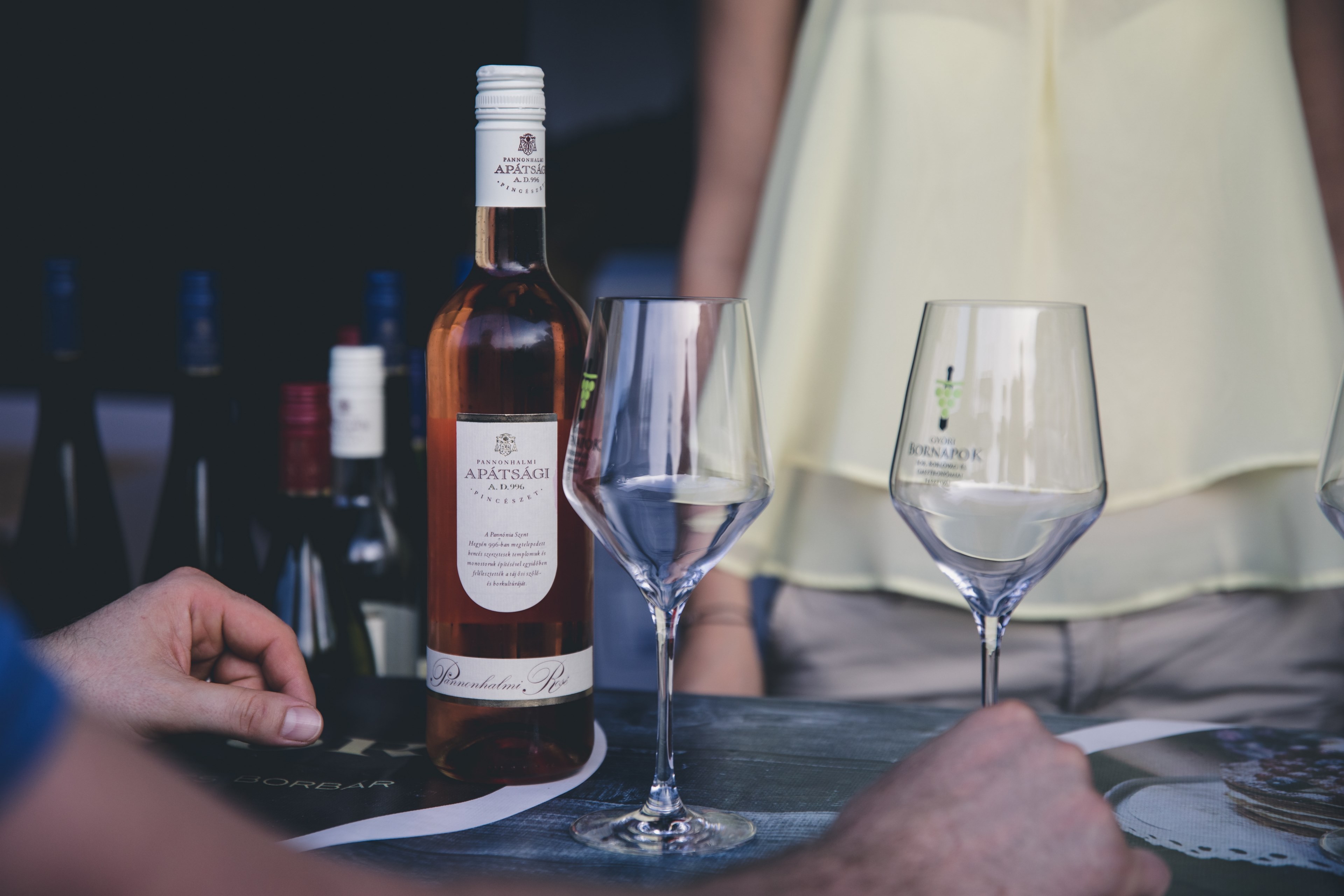 a guy preparing two glasses of wine as a girl walks toward the table, _preparing wine 4k, HD Wallpaper