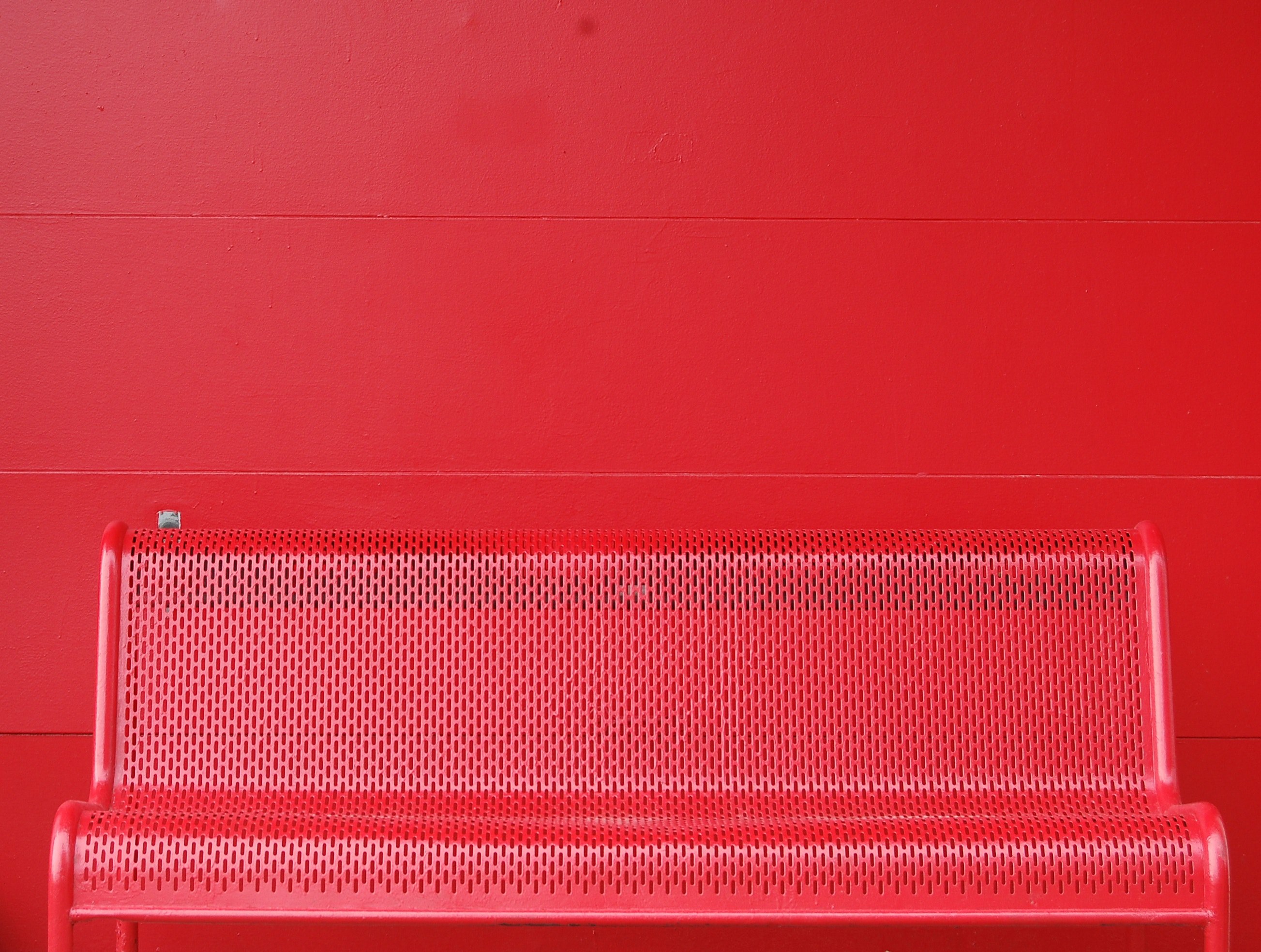 a red colored steel bench is attached to a red wall in columbus, _red bench wall columbus 4k, HD Wallpaper
