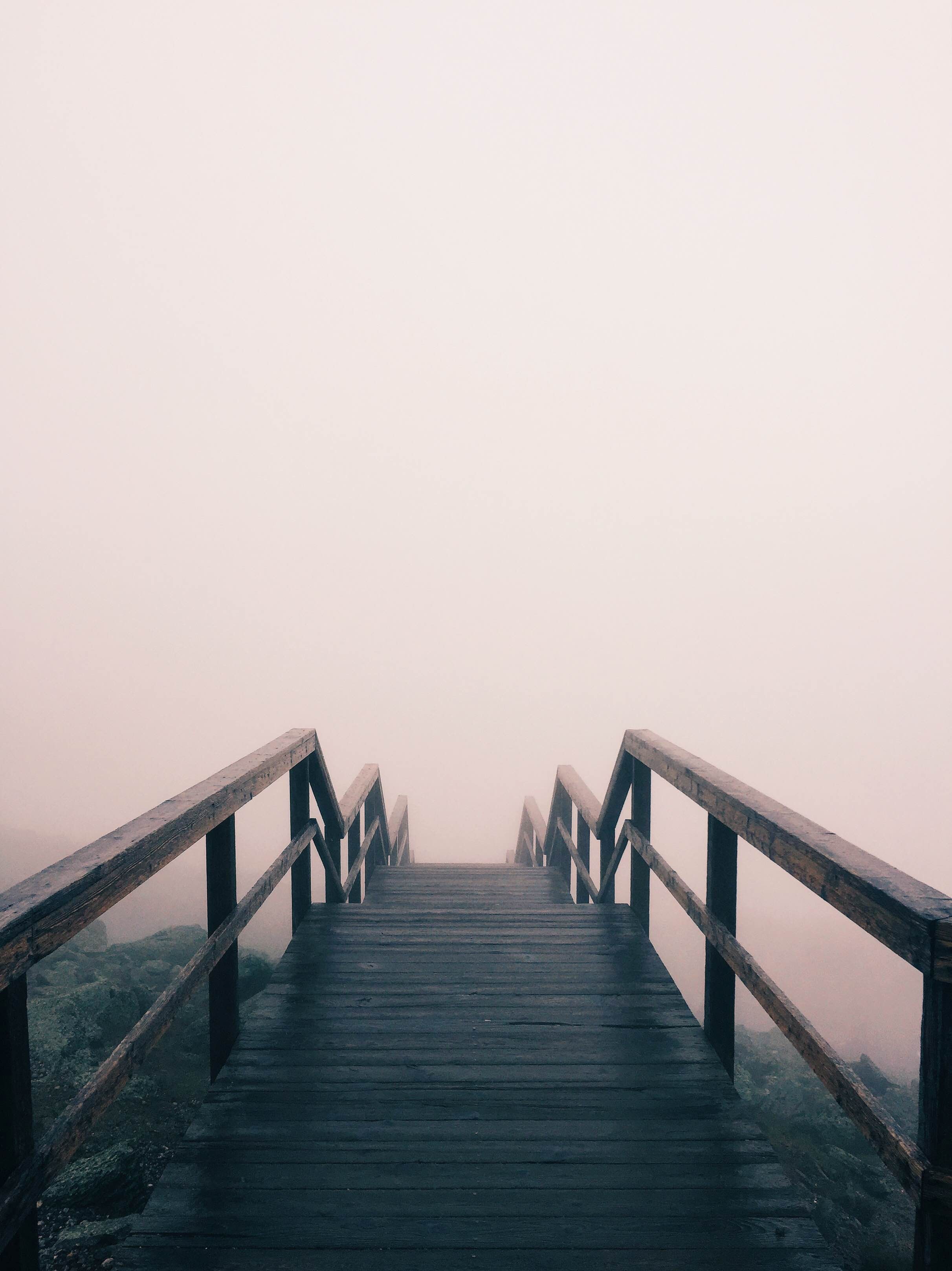stairs lead down a rocky hillside and disappear into fog, descent into the mist 4k, Phone HD Wallpaper