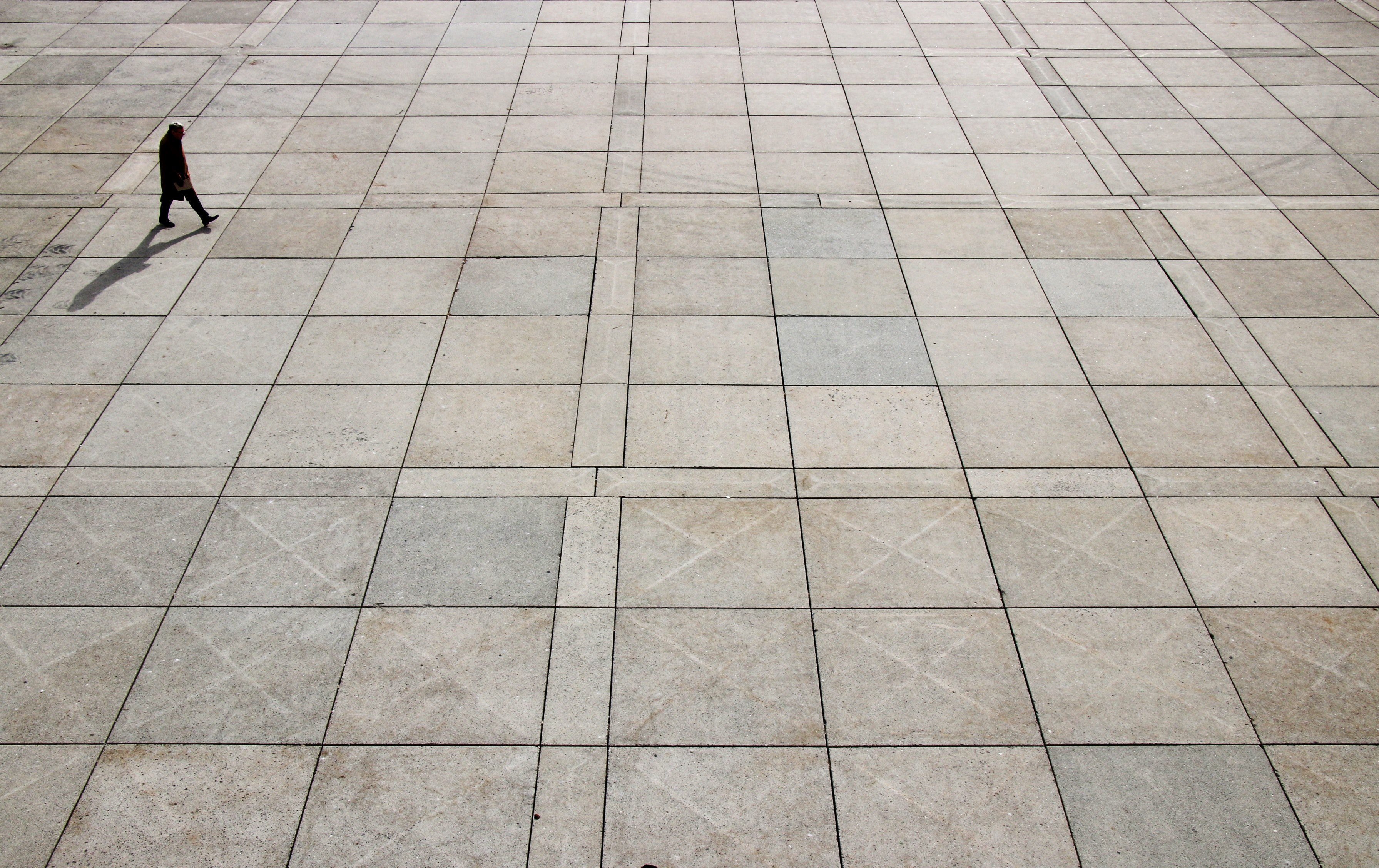 a high shot of a lone person walking across a large plaza, no one is alone 4k, HD Wallpaper